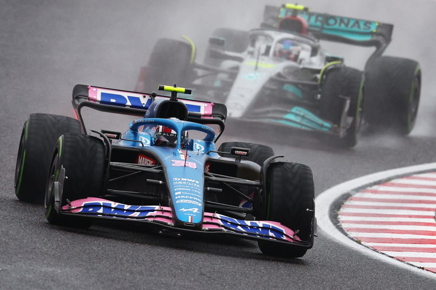 SUZUKA, JAPAN - OCTOBER 09: Esteban Ocon of France driving the (31) Alpine F1 A522 Renault leads