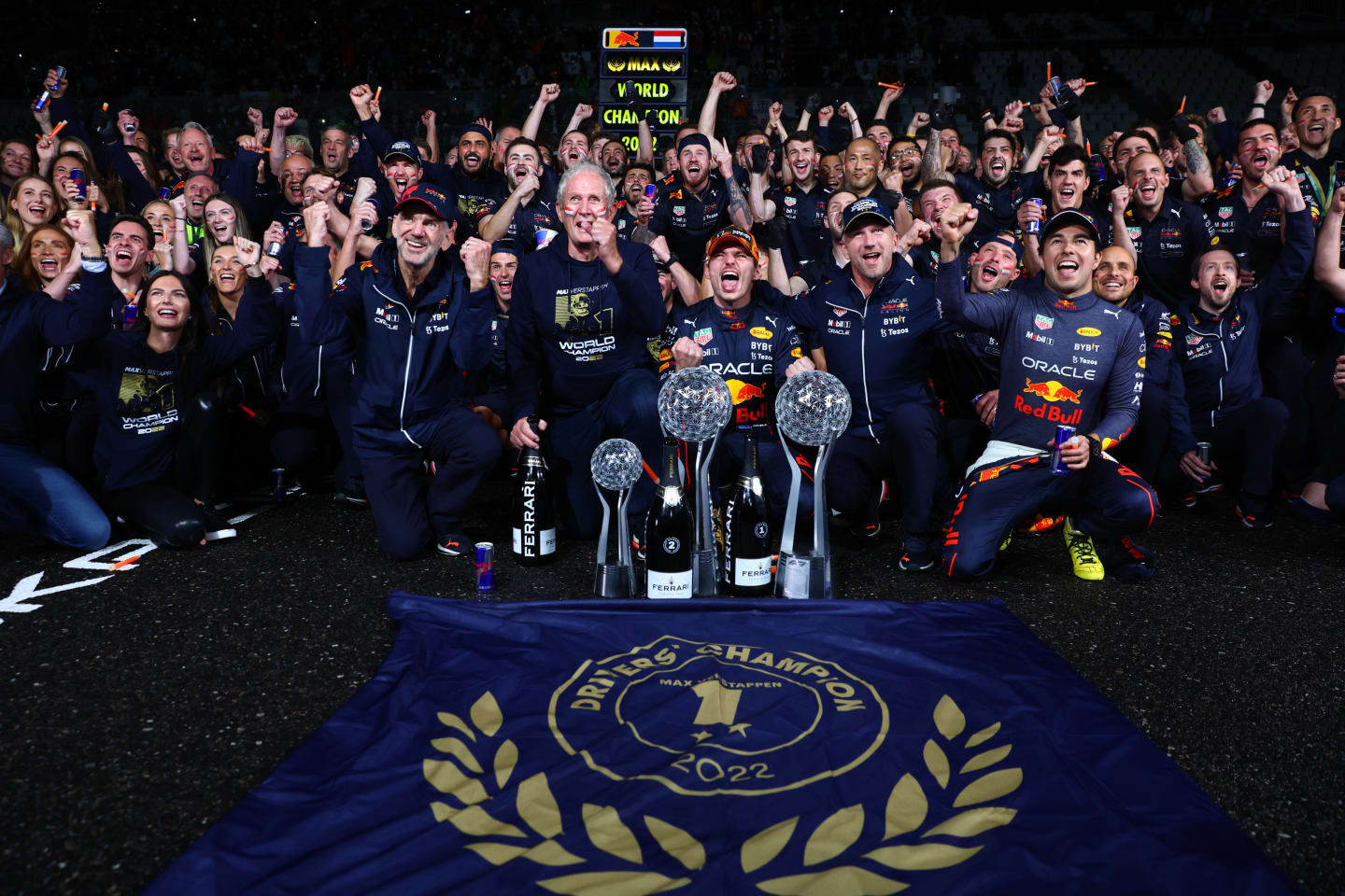 SUZUKA, JAPAN - OCTOBER 09: Race winner and 2022 F1 World Drivers Champion Max Verstappen of Netherlands and Oracle Red Bull Racing celebrates with his team after the F1 Grand Prix of Japan at Suzuka International Racing Course on October 09, 2022 in Suzuka, Japan. (Photo by Dan Istitene - Formula 1/Formula 1 via Getty Images)