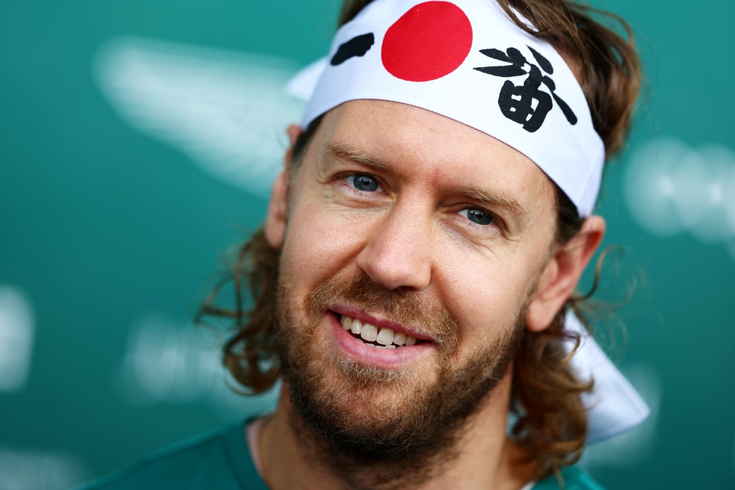 SUZUKA, JAPAN - OCTOBER 06: Sebastian Vettel of Germany and Aston Martin F1 Team talks to the media