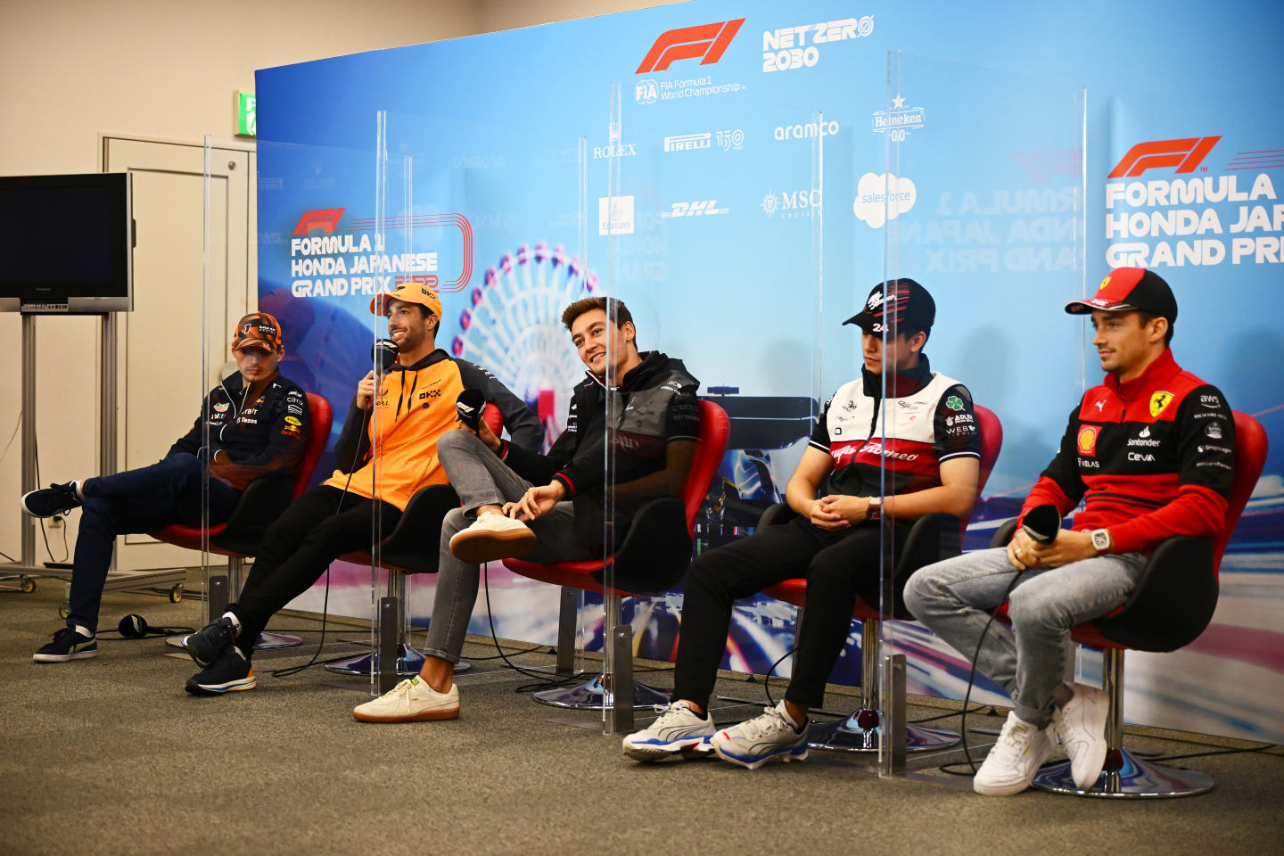 SUZUKA, JAPAN - OCTOBER 06: Max Verstappen of the Netherlands and Oracle Red Bull Racing, Daniel Ricciardo of Australia and McLaren, George Russell of Great Britain and Mercedes, Zhou Guanyu of China and Alfa Romeo F1 and Charles Leclerc of Monaco and Ferrari attend the Drivers Press Conference during previews ahead of the F1 Grand Prix of Japan at Suzuka International Racing Course on October 06, 2022 in Suzuka, Japan. (Photo by Clive Mason/Getty Images)