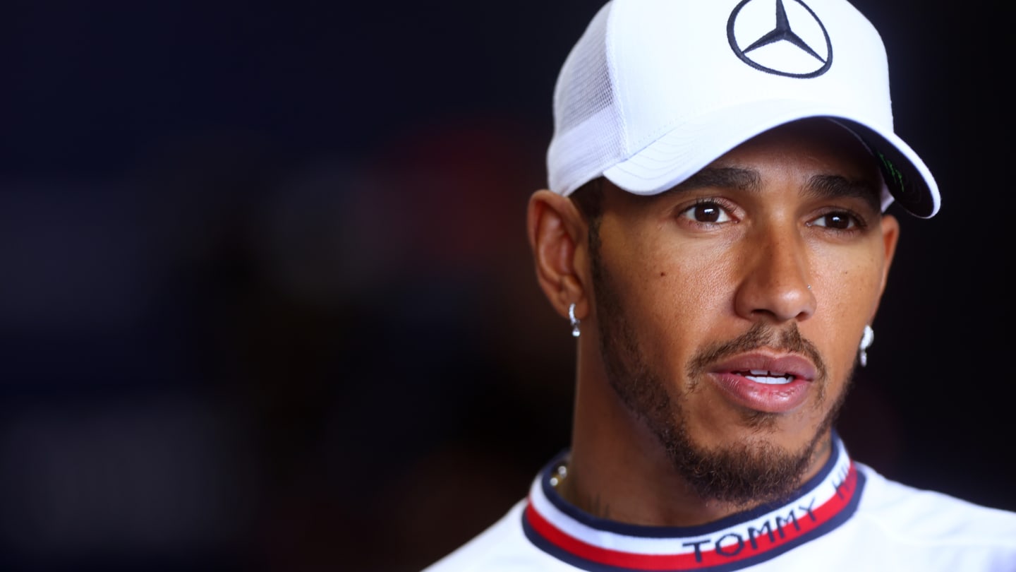 SUZUKA, JAPAN - OCTOBER 06: Lewis Hamilton of Great Britain and Mercedes talks to the media in the