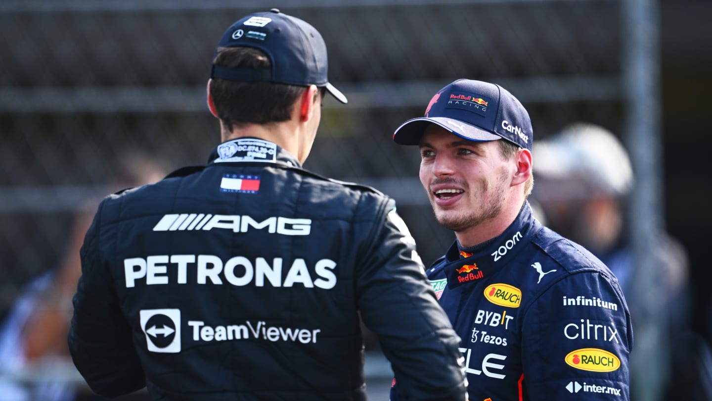 MEXICO CITY, MEXICO - OCTOBER 29: Pole position qualifier Max Verstappen of the Netherlands and Oracle Red Bull Racing and Second placed qualifier George Russell of Great Britain and Mercedes talk in parc ferme during qualifying ahead of the F1 Grand Prix of Mexico at Autodromo Hermanos Rodriguez on October 29, 2022 in Mexico City, Mexico. (Photo by Clive Mason - Formula 1/Formula 1 via Getty Images)