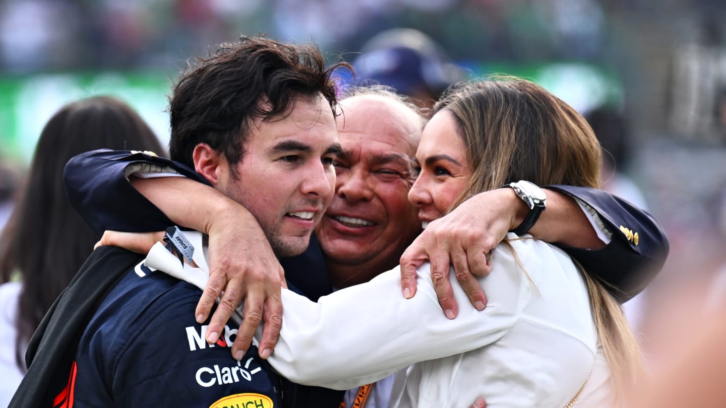 MEXICO CITY, MEXICO - OCTOBER 30: Third placed Sergio Perez of Mexico and Oracle Red Bull Racing celebrates with his father Antonio Perez Garibay and sister Paola Perez during the F1 Grand Prix of Mexico at Autodromo Hermanos Rodriguez on October 30, 2022 in Mexico City, Mexico. (Photo by Clive Mason - Formula 1/Formula 1 via Getty Images)