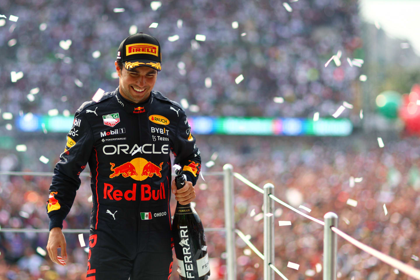 MEXICO CITY, MEXICO - OCTOBER 30: Third placed Sergio Perez of Mexico and Oracle Red Bull Racing celebrates on the podium after the F1 Grand Prix of Mexico at Autodromo Hermanos Rodriguez on October 30, 2022 in Mexico City, Mexico. (Photo by Dan Istitene - Formula 1/Formula 1 via Getty Images)