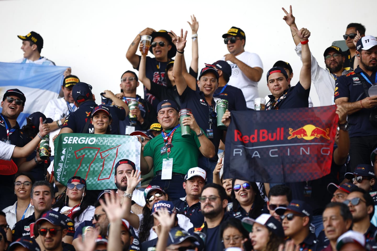 MEXICO CITY, MEXICO - OCTOBER 30: Sergio Perez of Mexico and Oracle Red Bull Racing fans show their