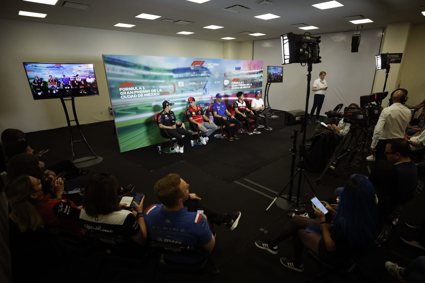 MEXICO CITY, MEXICO - OCTOBER 27: (L-R) Sergio Perez of Mexico and Oracle Red Bull Racing, Charles Leclerc of Monaco and Ferrari, Mick Schumacher of Germany and Haas F1, Zhou Guanyu of China and Alfa Romeo F1 and Fernando Alonso of Spain and Alpine F1 attend the Drivers Press Conference  during previews ahead of the F1 Grand Prix of Mexico at Autodromo Hermanos Rodriguez on October 27, 2022 in Mexico City, Mexico. (Photo by Jared C. Tilton/Getty Images)