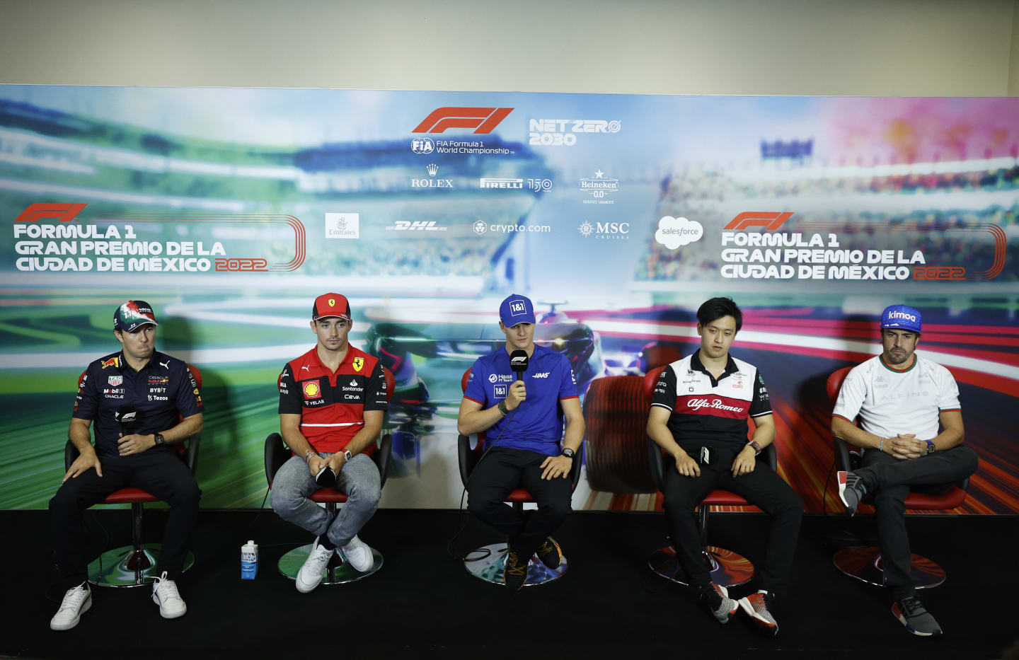 MEXICO CITY, MEXICO - OCTOBER 27: (L-R) Sergio Perez of Mexico and Oracle Red Bull Racing, Charles Leclerc of Monaco and Ferrari, Mick Schumacher of Germany and Haas F1, Zhou Guanyu of China and Alfa Romeo F1 and Fernando Alonso of Spain and Alpine F1 attend the Drivers Press Conference  during previews ahead of the F1 Grand Prix of Mexico at Autodromo Hermanos Rodriguez on October 27, 2022 in Mexico City, Mexico. (Photo by Jared C. Tilton/Getty Images)