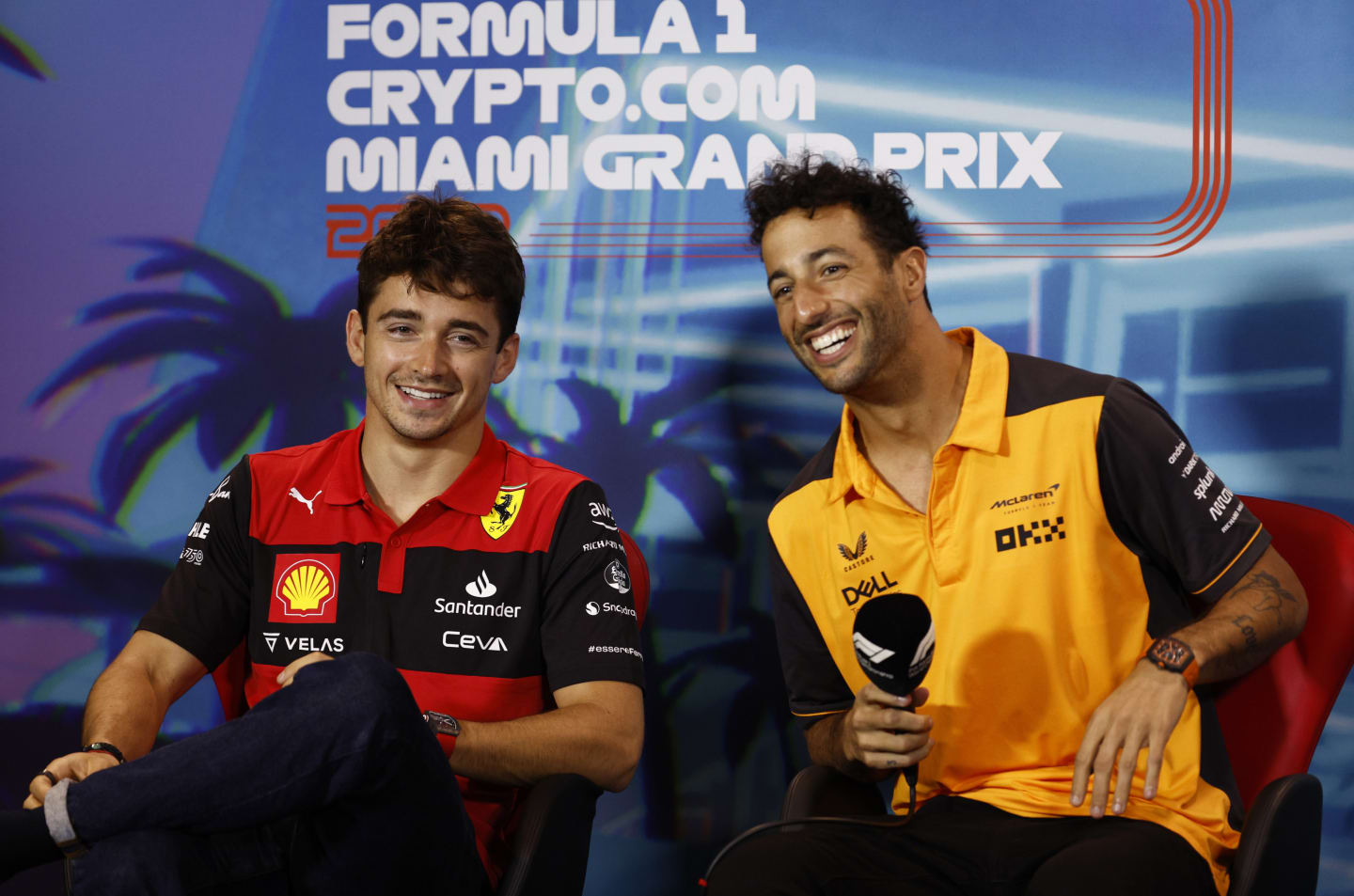 MIAMI, FLORIDA - MAY 06: Charles Leclerc of Monaco and Ferrari and Daniel Ricciardo of Australia and McLaren smile in the Drivers Press Conference prior to practice ahead of the F1 Grand Prix of Miami at the Miami International Autodrome on May 06, 2022 in Miami, Florida. (Photo by Jared C. Tilton/Getty Images)