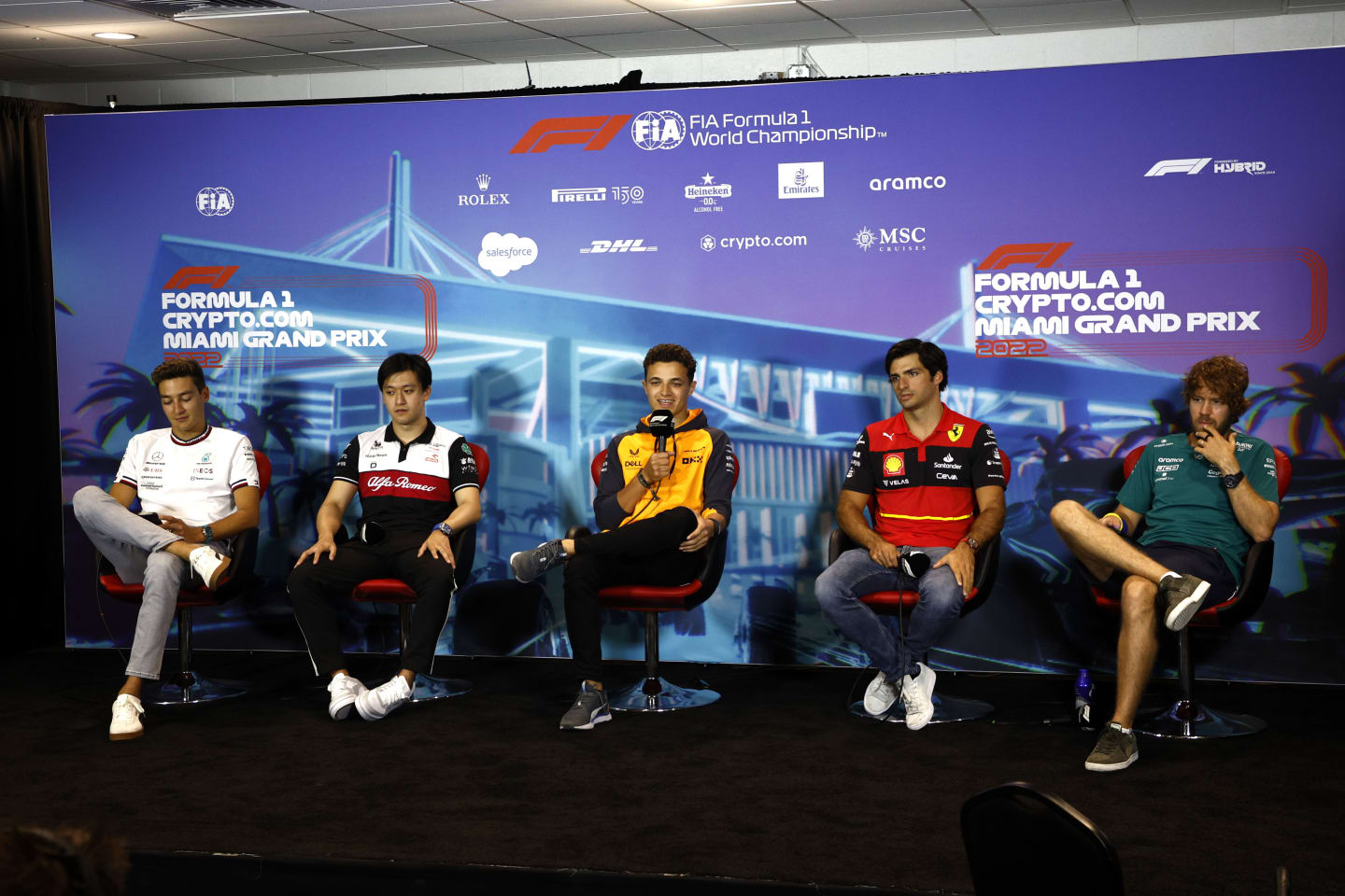 MIAMI, FLORIDA - MAY 06: (L-R) George Russell of Great Britain and Mercedes, Zhou Guanyu of China and Alfa Romeo F1, Lando Norris of Great Britain and McLaren, Carlos Sainz of Spain and Ferrari and Sebastian Vettel of Germany and Aston Martin F1 Team attend the Drivers Press Conference prior to practice ahead of the F1 Grand Prix of Miami at the Miami International Autodrome on May 06, 2022 in Miami, Florida. (Photo by Jared C. Tilton/Getty Images)