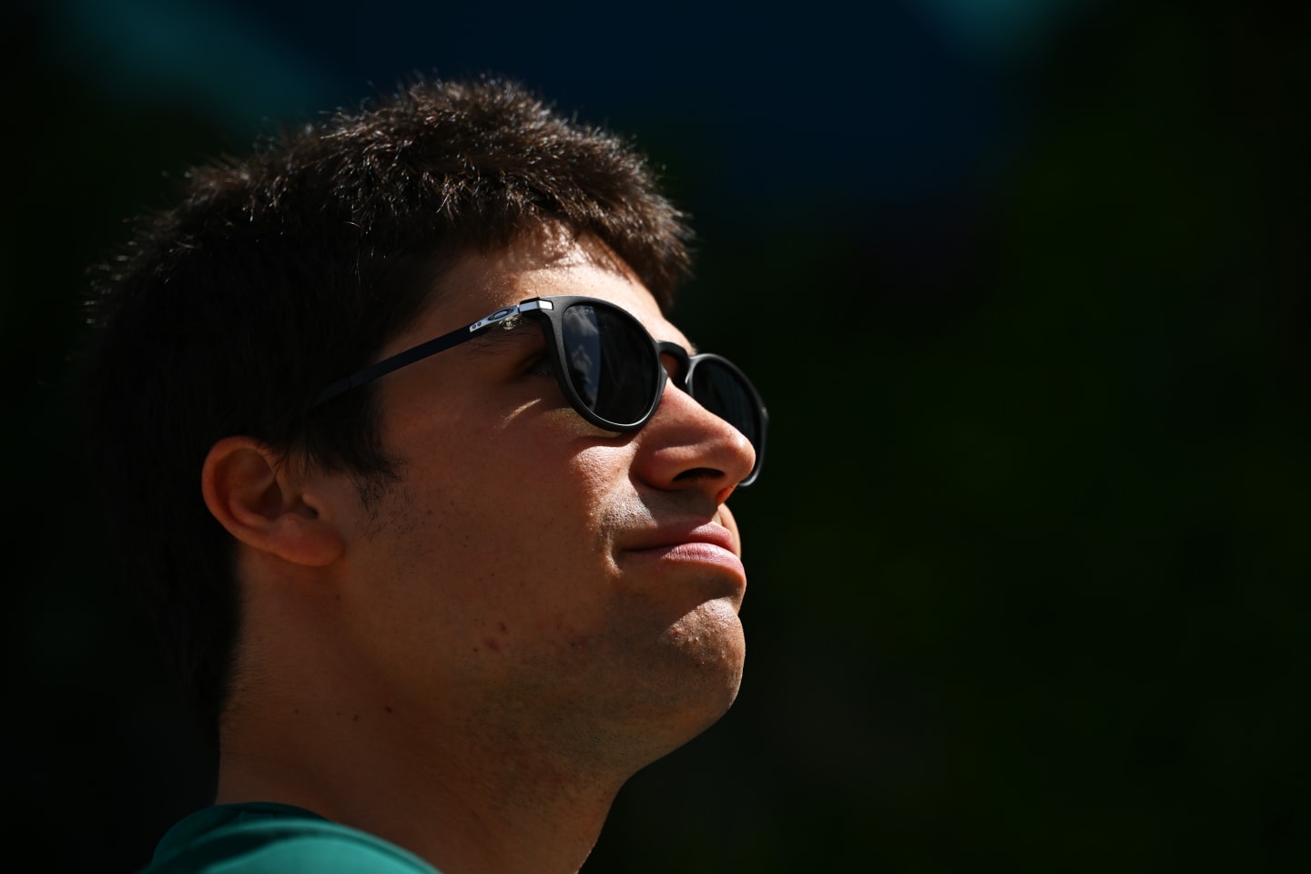 MIAMI, FLORIDA - MAY 08: Lance Stroll of Canada and Aston Martin F1 Team looks on in the Paddock prior to the F1 Grand Prix of Miami at the Miami International Autodrome on May 08, 2022 in Miami, Florida. (Photo by Clive Mason - Formula 1/Formula 1 via Getty Images)