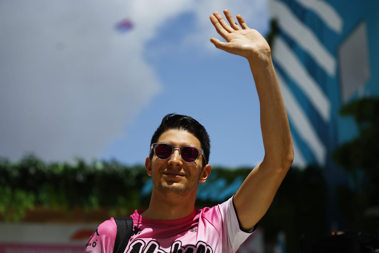 MIAMI, FLORIDA - MAY 08: Esteban Ocon of France and Alpine F1 waves to the crowd from the paddock prior to the F1 Grand Prix of Miami at the Miami International Autodrome on May 08, 2022 in Miami, Florida. (Photo by Jared C. Tilton/Getty Images)