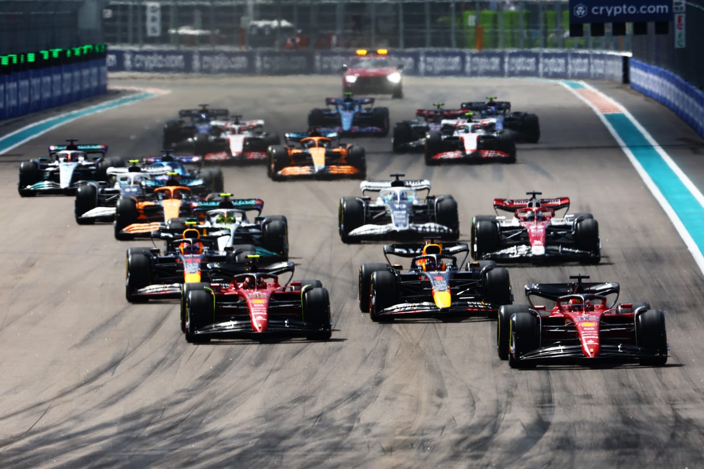 MIAMI, FLORIDA - MAY 08: Charles Leclerc of Monaco driving (16) the Ferrari F1-75 leads Max