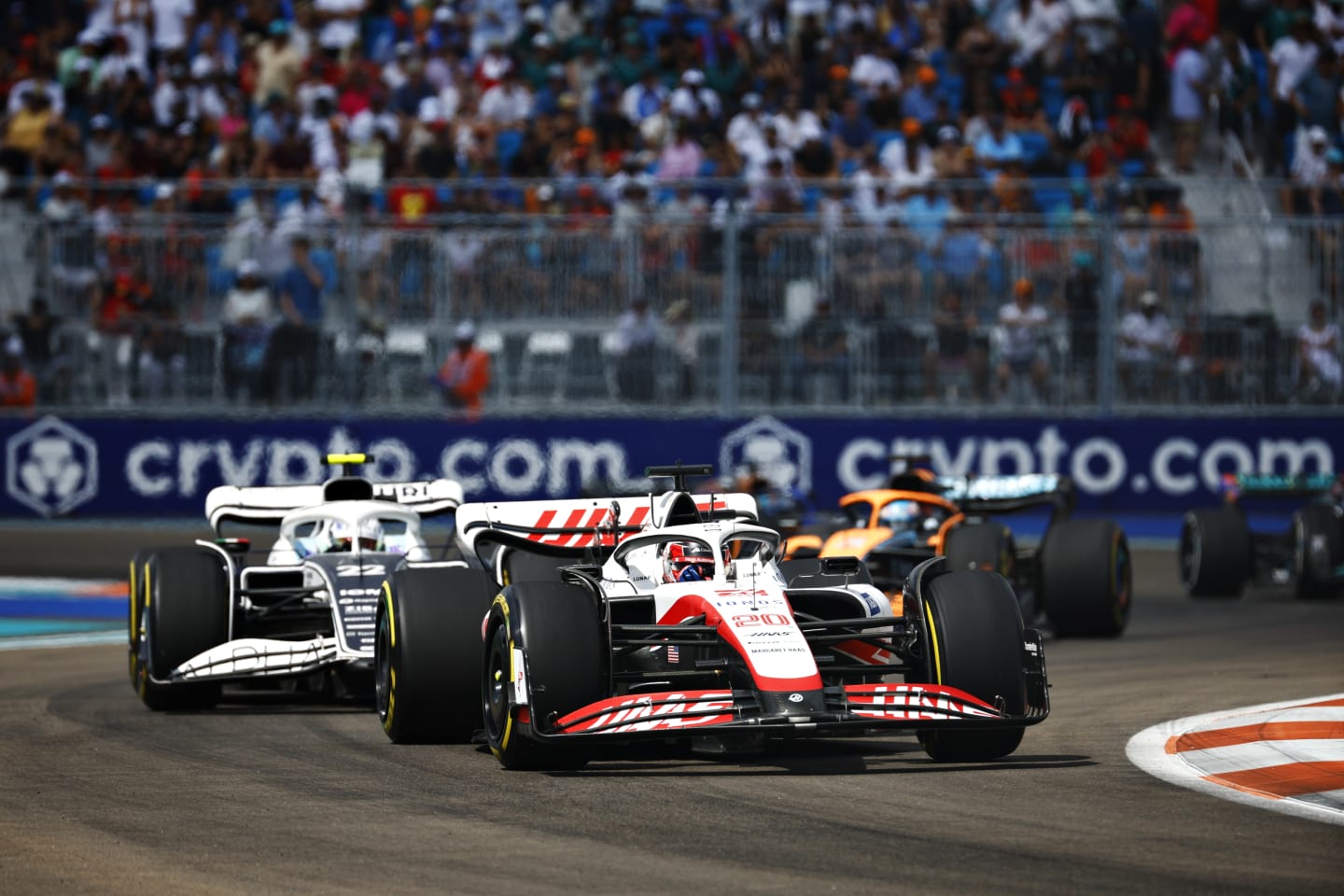 MIAMI, FLORIDA - MAY 08: Kevin Magnussen of Denmark driving the (20) Haas F1 VF-22 Ferrari leads Yuki Tsunoda of Japan driving the (22) Scuderia AlphaTauri AT03 during the F1 Grand Prix of Miami at the Miami International Autodrome on May 08, 2022 in Miami, Florida. (Photo by Jared C. Tilton/Getty Images)