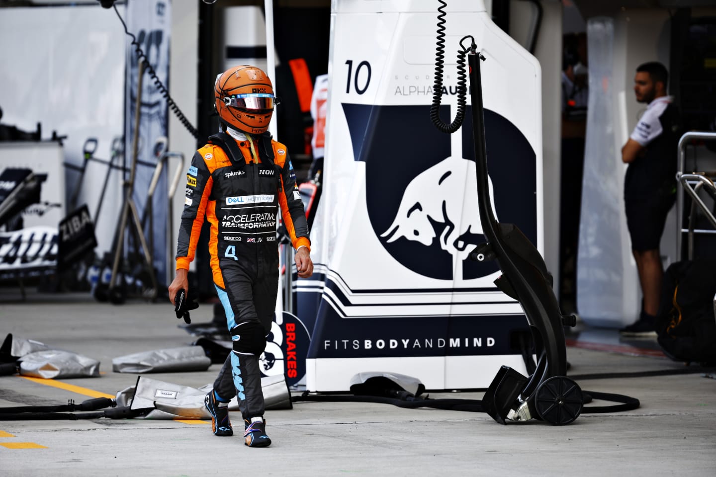 MIAMI, FLORIDA - MAY 08: Lando Norris of Great Britain and McLaren walks in the Pitlane after crashing out of the race during the F1 Grand Prix of Miami at the Miami International Autodrome on May 08, 2022 in Miami, Florida. (Photo by Jared C. Tilton/Getty Images)