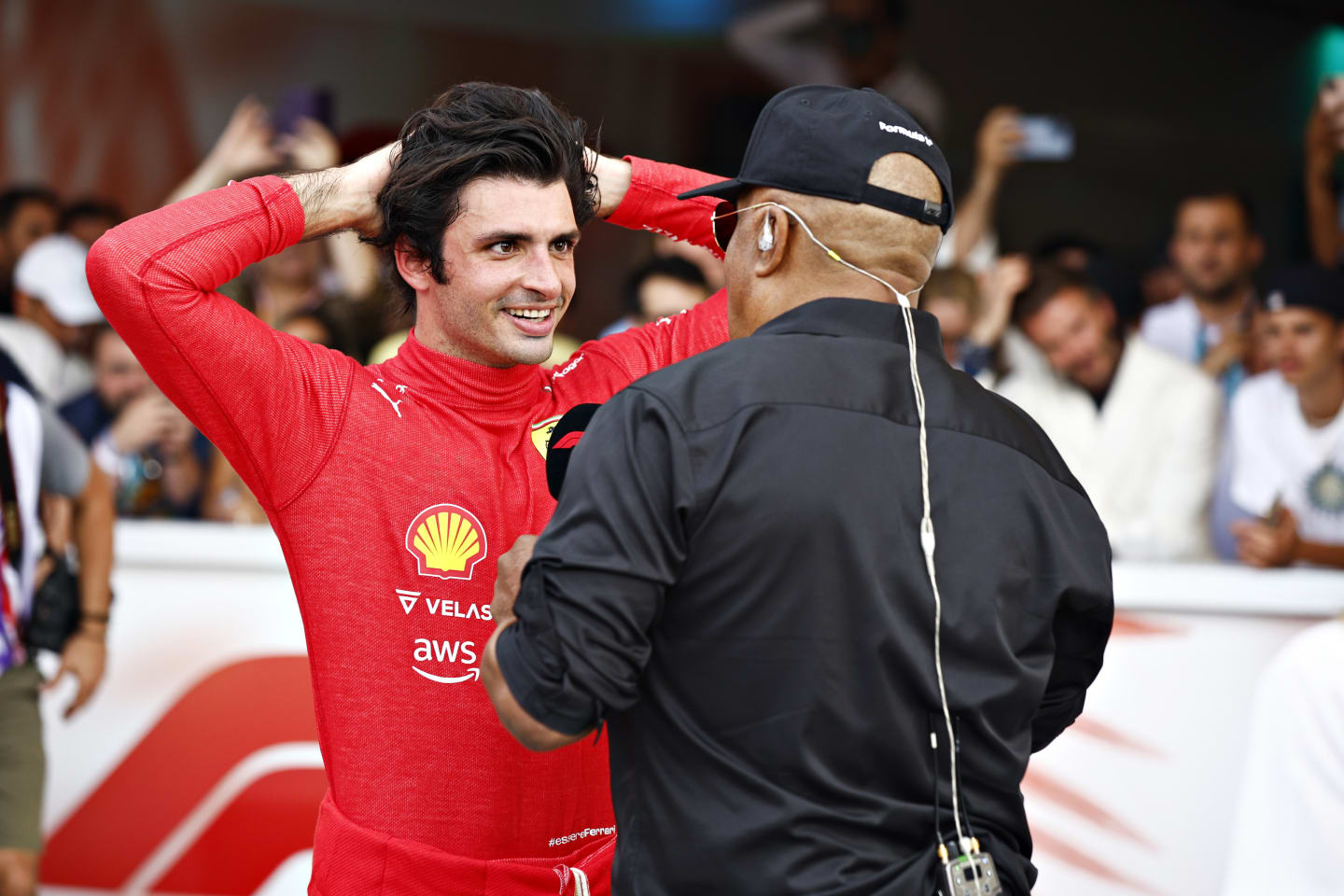 MIAMI, FLORIDA - MAY 08: Third placed Carlos Sainz of Spain and Ferrari talks with Willy T Ribbs in