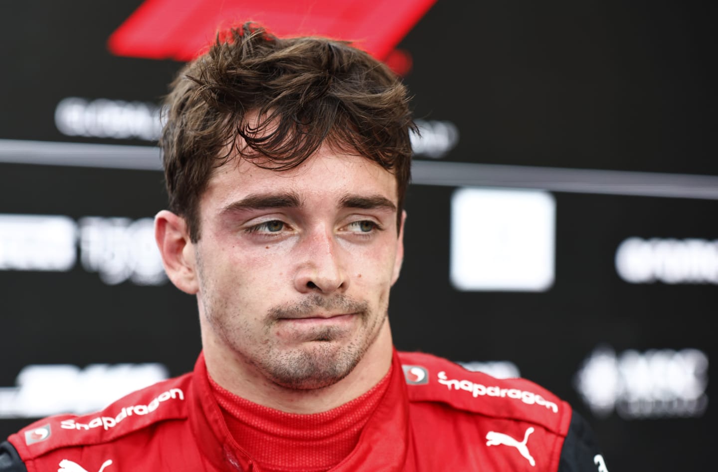 MIAMI, FLORIDA - MAY 08: Second placed Charles Leclerc of Monaco and Ferrari looks on in parc ferme during the F1 Grand Prix of Miami at the Miami International Autodrome on May 08, 2022 in Miami, Florida. (Photo by Jared C. Tilton/Getty Images)