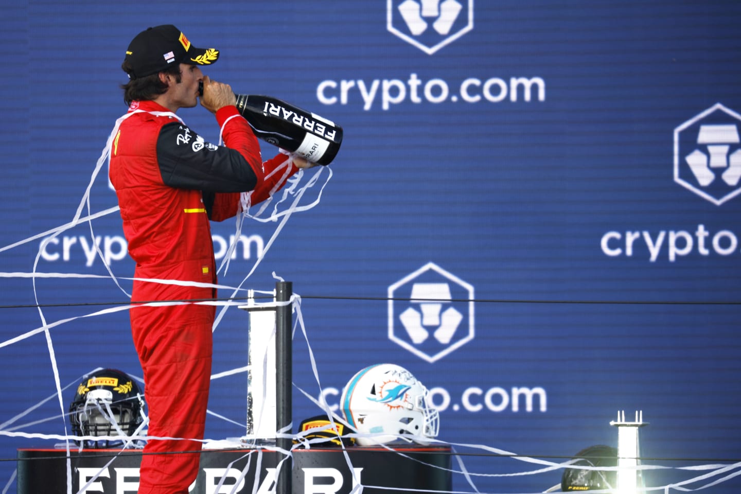 MIAMI, FLORIDA - MAY 08: Third placed Carlos Sainz of Spain and Ferrari celebrates on the podium during the F1 Grand Prix of Miami at the Miami International Autodrome on May 08, 2022 in Miami, Florida. (Photo by Chris Graythen/Getty Images)