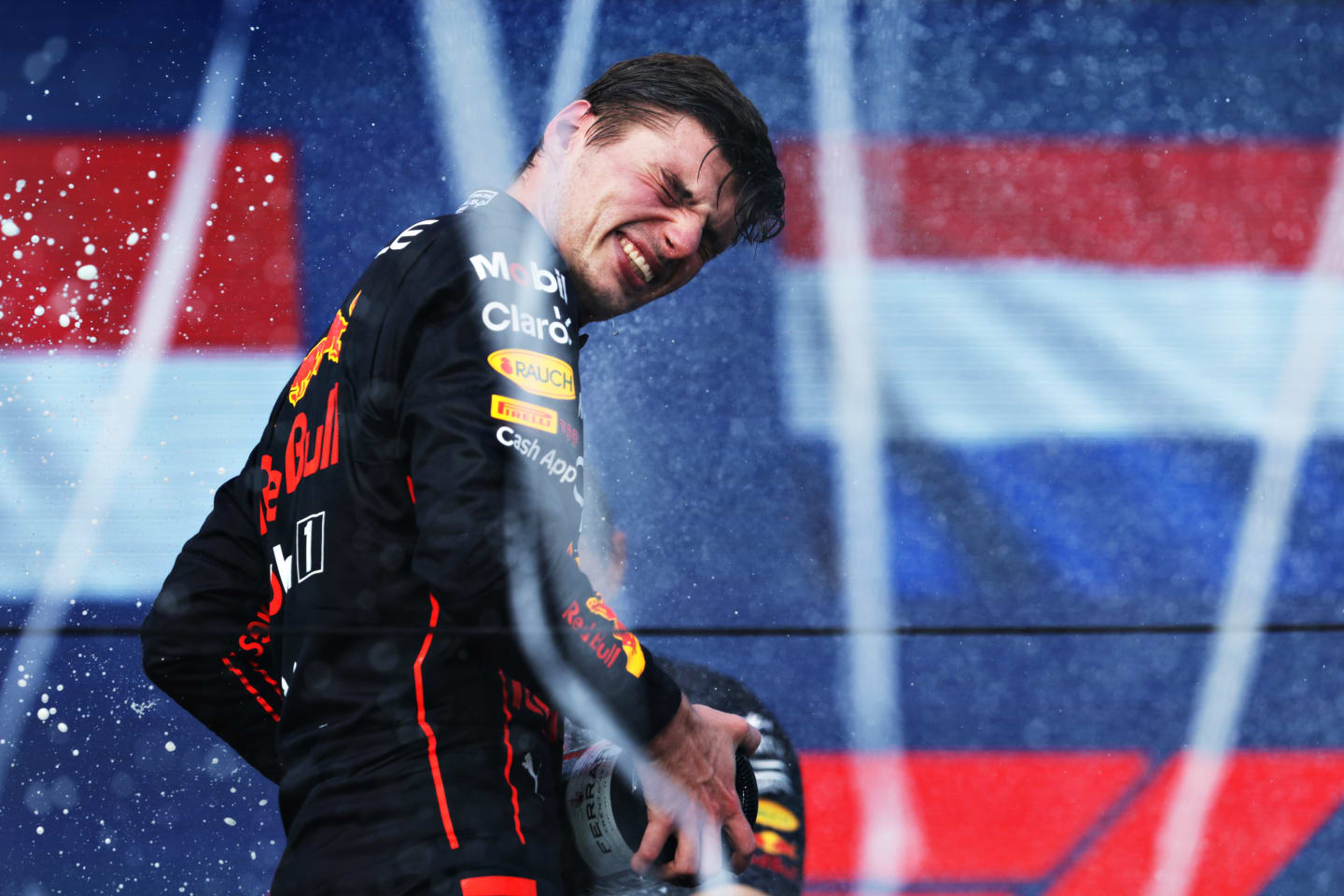 MIAMI, FLORIDA - MAY 08: Race winner Max Verstappen of the Netherlands and Oracle Red Bull Racing celebrates on the podium during the F1 Grand Prix of Miami at the Miami International Autodrome on May 08, 2022 in Miami, Florida. (Photo by Mark Thompson/Getty Images)