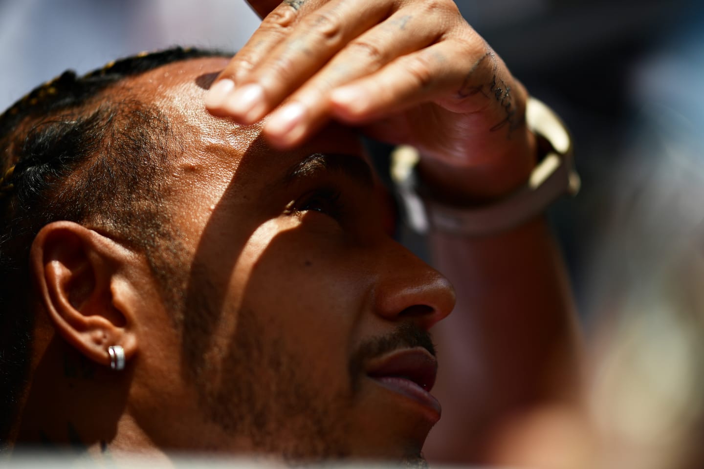 MIAMI, FLORIDA - MAY 08: Lewis Hamilton of Great Britain and Mercedes looks on in the Paddock