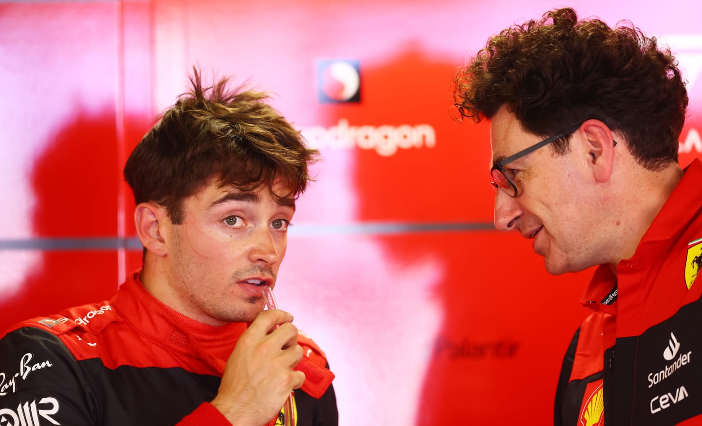 MONTE-CARLO, MONACO - MAY 28: Charles Leclerc of Monaco and Ferrari talks with Scuderia Ferrari
