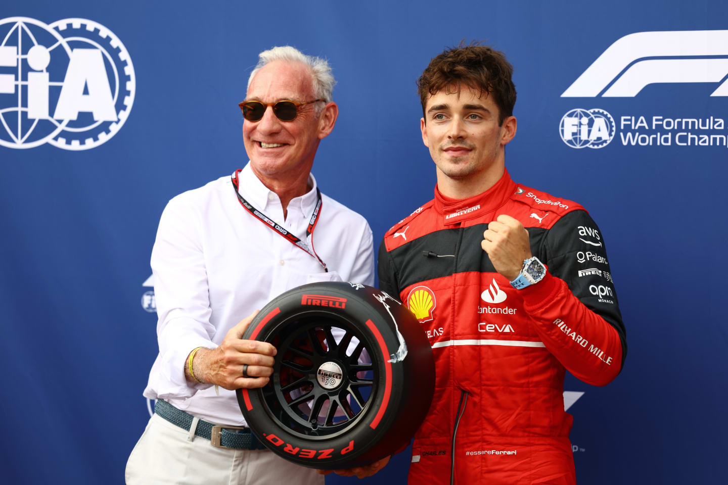 MONTE-CARLO, MONACO - MAY 28: Pole position qualifier Charles Leclerc of Monaco and Ferrari is presented with the Pirelli Pole Position trophy by Liberty CEO Greg Maffei during qualifying ahead of the F1 Grand Prix of Monaco at Circuit de Monaco on May 28, 2022 in Monte-Carlo, Monaco. (Photo by Mark Thompson/Getty Images)