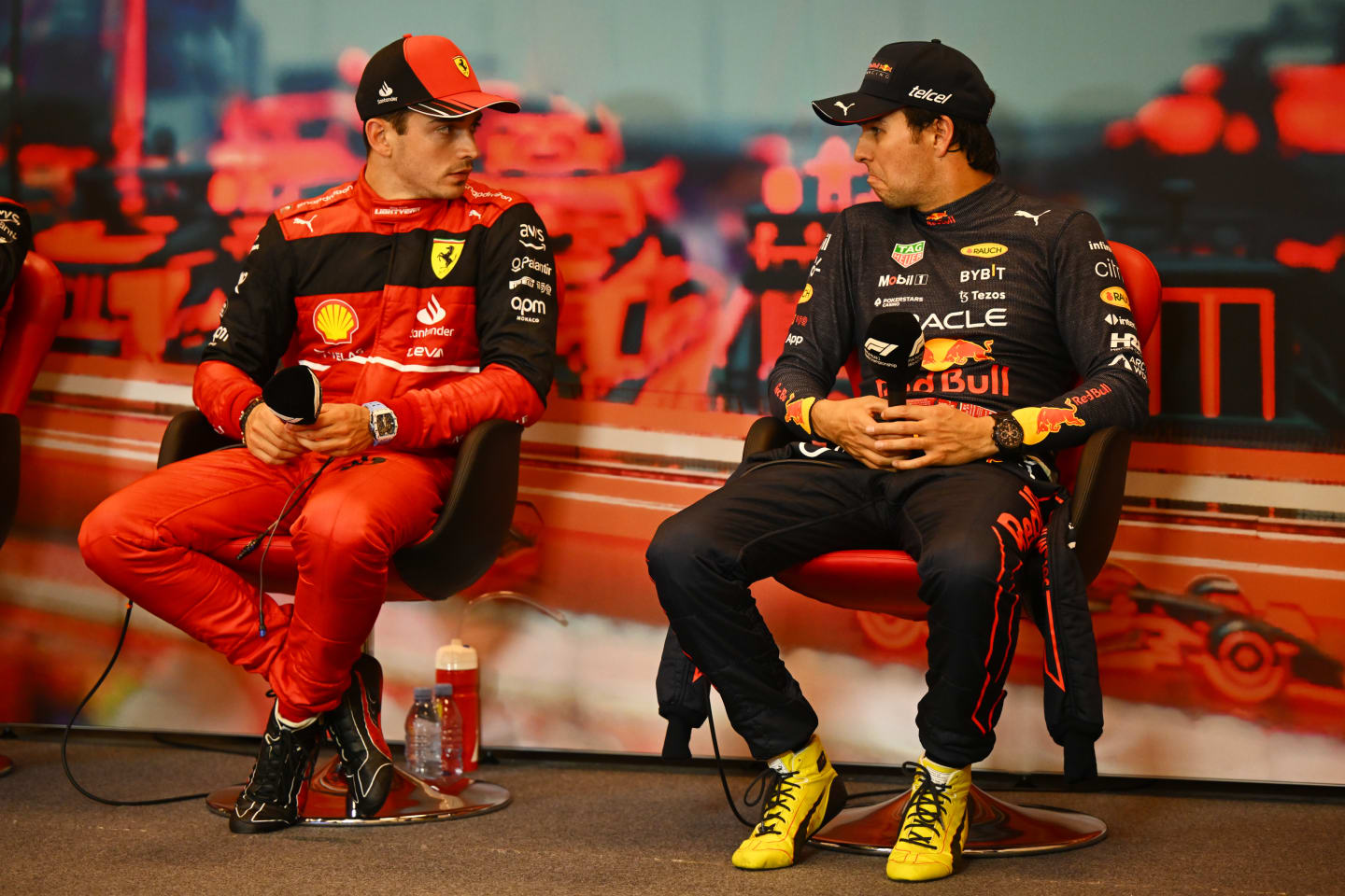 MONTE-CARLO, MONACO - MAY 28: Pole position qualifier Charles Leclerc of Monaco and Ferrari and Third placed qualifier Sergio Perez of Mexico and Oracle Red Bull Racing talk in the press conference after qualifying ahead of the F1 Grand Prix of Monaco at Circuit de Monaco on May 28, 2022 in Monte-Carlo, Monaco. (Photo by Clive Mason/Getty Images)