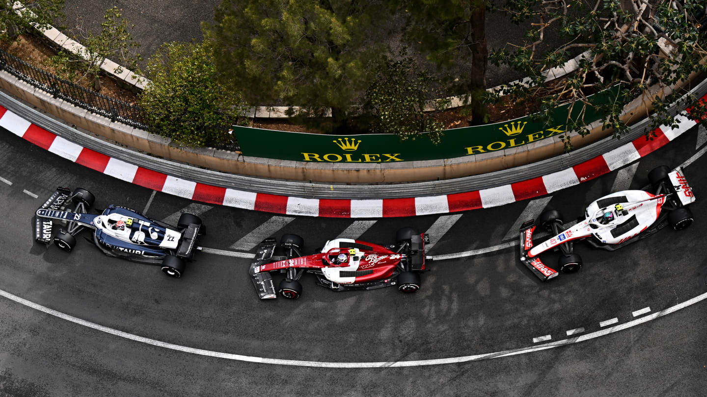 MONTE-CARLO, MONACO - MAY 29: Yuki Tsunoda of Japan driving the (22) Scuderia AlphaTauri AT03 leads Zhou Guanyu of China driving the (24) Alfa Romeo F1 C42 Ferrari and Mick Schumacher of Germany driving the (47) Haas F1 VF-22 Ferrari during the F1 Grand Prix of Monaco at Circuit de Monaco on May 29, 2022 in Monte-Carlo, Monaco. (Photo by Clive Mason - Formula 1/Formula 1 via Getty Images)