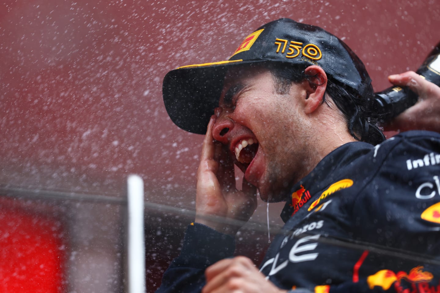 MONTE-CARLO, MONACO - MAY 29: Race winner Sergio Perez of Mexico and Oracle Red Bull Racing celebrates on the podium during the F1 Grand Prix of Monaco at Circuit de Monaco on May 29, 2022 in Monte-Carlo, Monaco. (Photo by Mark Thompson/Getty Images)