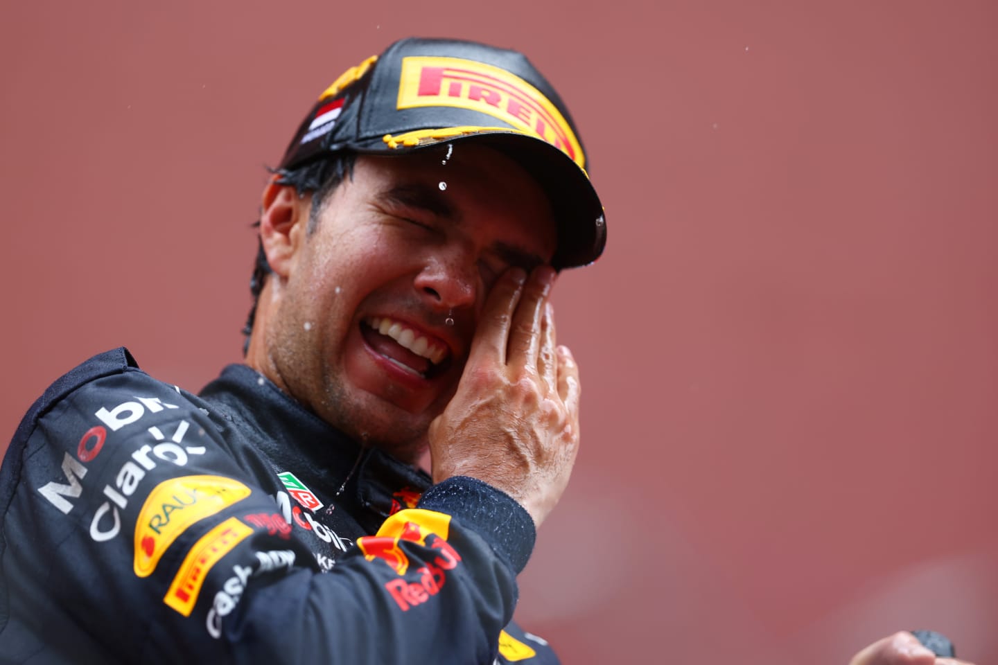 MONTE-CARLO, MONACO - MAY 29: Race winner Sergio Perez of Mexico and Oracle Red Bull Racing celebrates on the podium during the F1 Grand Prix of Monaco at Circuit de Monaco on May 29, 2022 in Monte-Carlo, Monaco. (Photo by Mark Thompson/Getty Images)