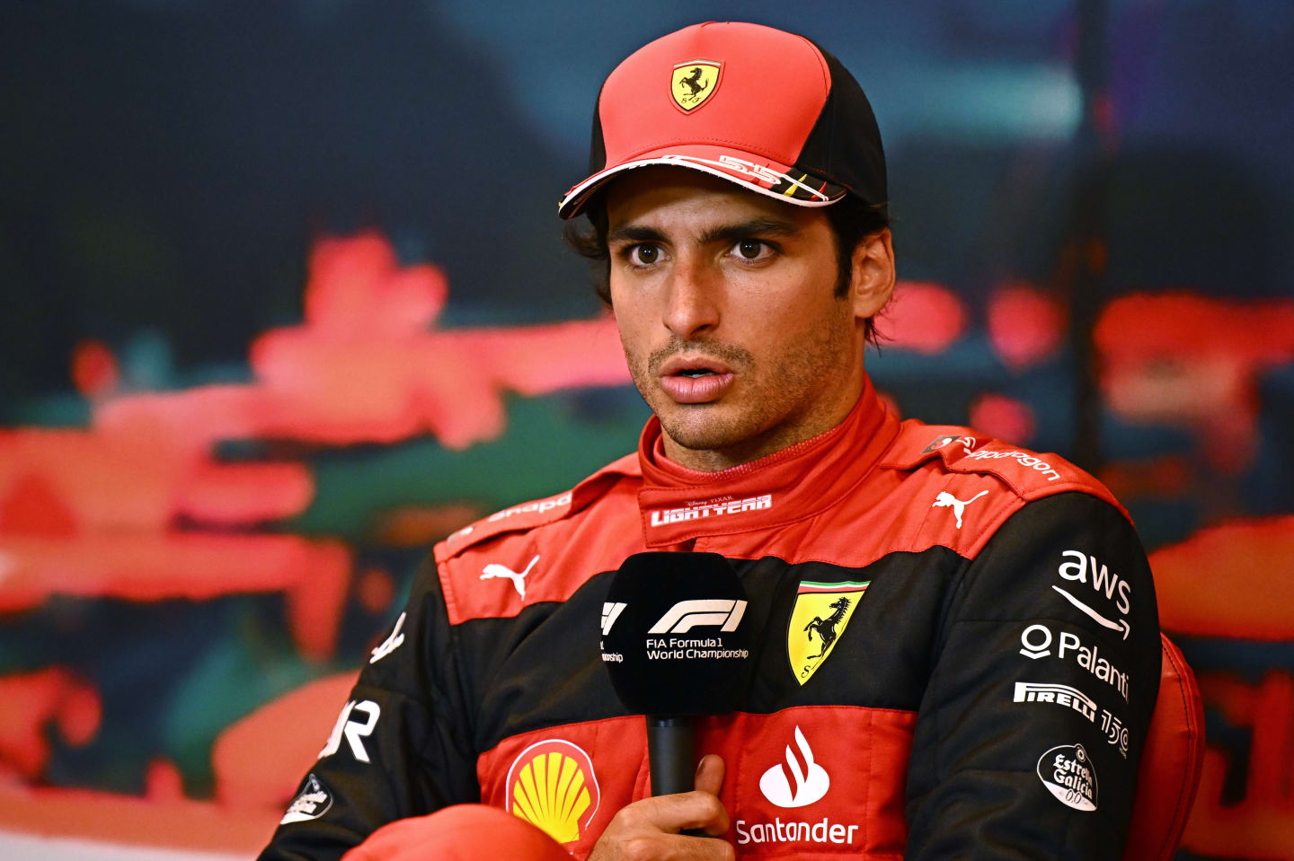 MONTE-CARLO, MONACO - MAY 29: Second placed Carlos Sainz of Spain and Ferrari talks in the press conference after the F1 Grand Prix of Monaco at Circuit de Monaco on May 29, 2022 in Monte-Carlo, Monaco. (Photo by Clive Mason/Getty Images)