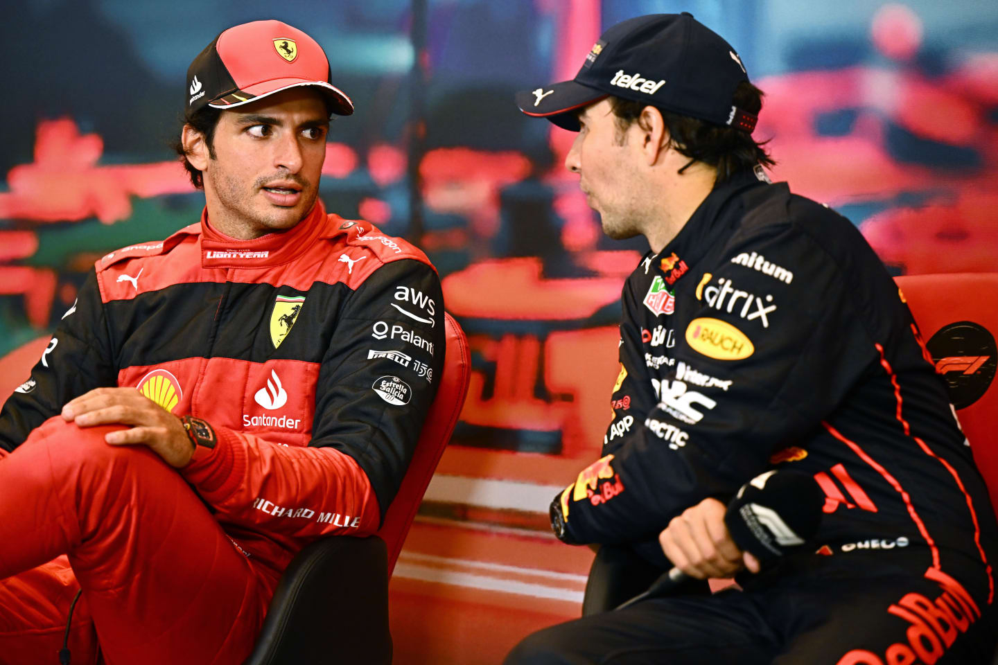 MONTE-CARLO, MONACO - MAY 29: Race winner Sergio Perez of Mexico and Oracle Red Bull Racing and Second placed Carlos Sainz of Spain and Ferrari talk in the press conference after the F1 Grand Prix of Monaco at Circuit de Monaco on May 29, 2022 in Monte-Carlo, Monaco. (Photo by Clive Mason/Getty Images)