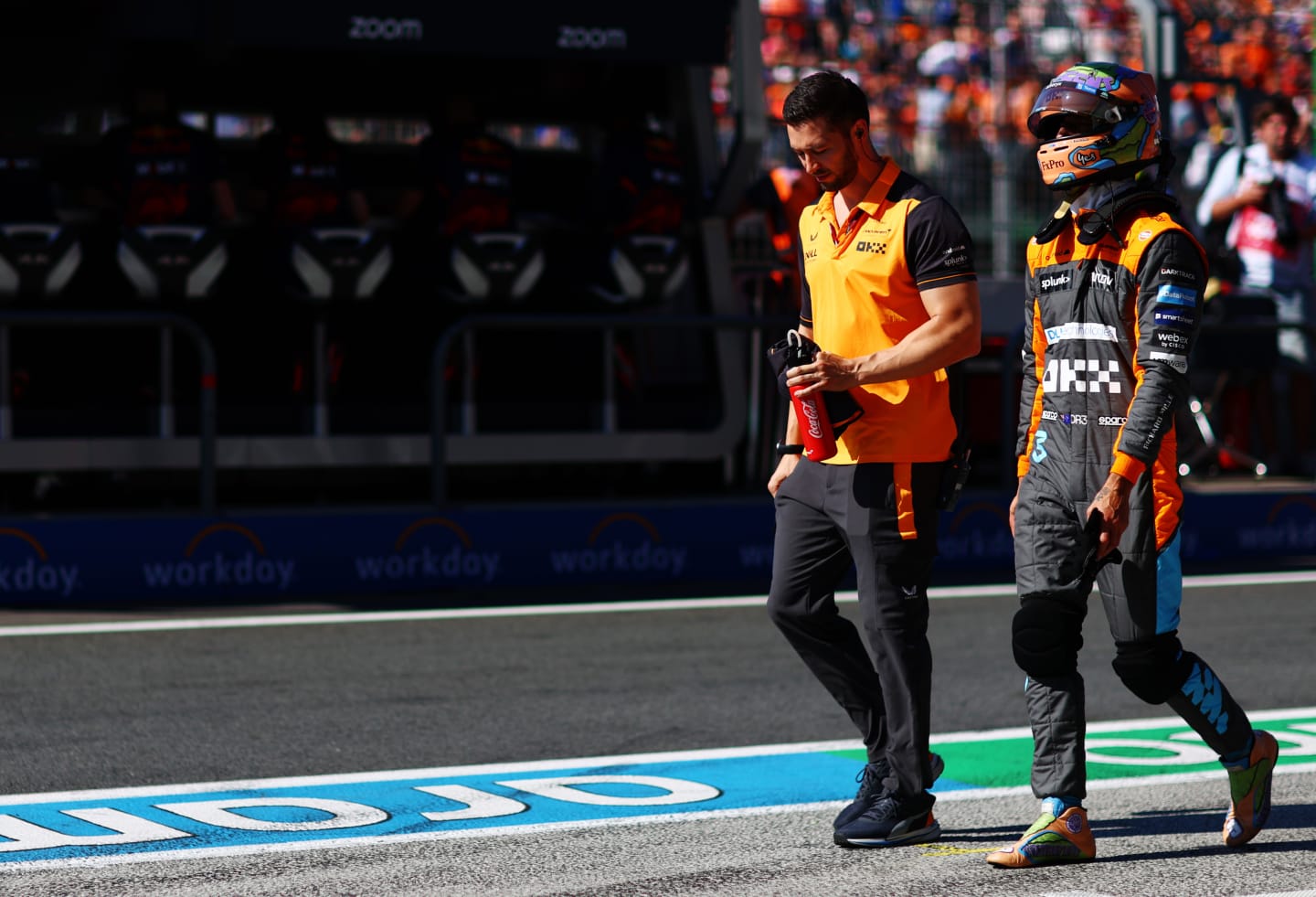 ZANDVOORT, NETHERLANDS - SEPTEMBER 03: 17th placed qualifier Daniel Ricciardo of Australia and McLaren walks in the Pitlane during qualifying ahead of the F1 Grand Prix of The Netherlands at Circuit Zandvoort on September 03, 2022 in Zandvoort, Netherlands. (Photo by Mark Thompson/Getty Images)