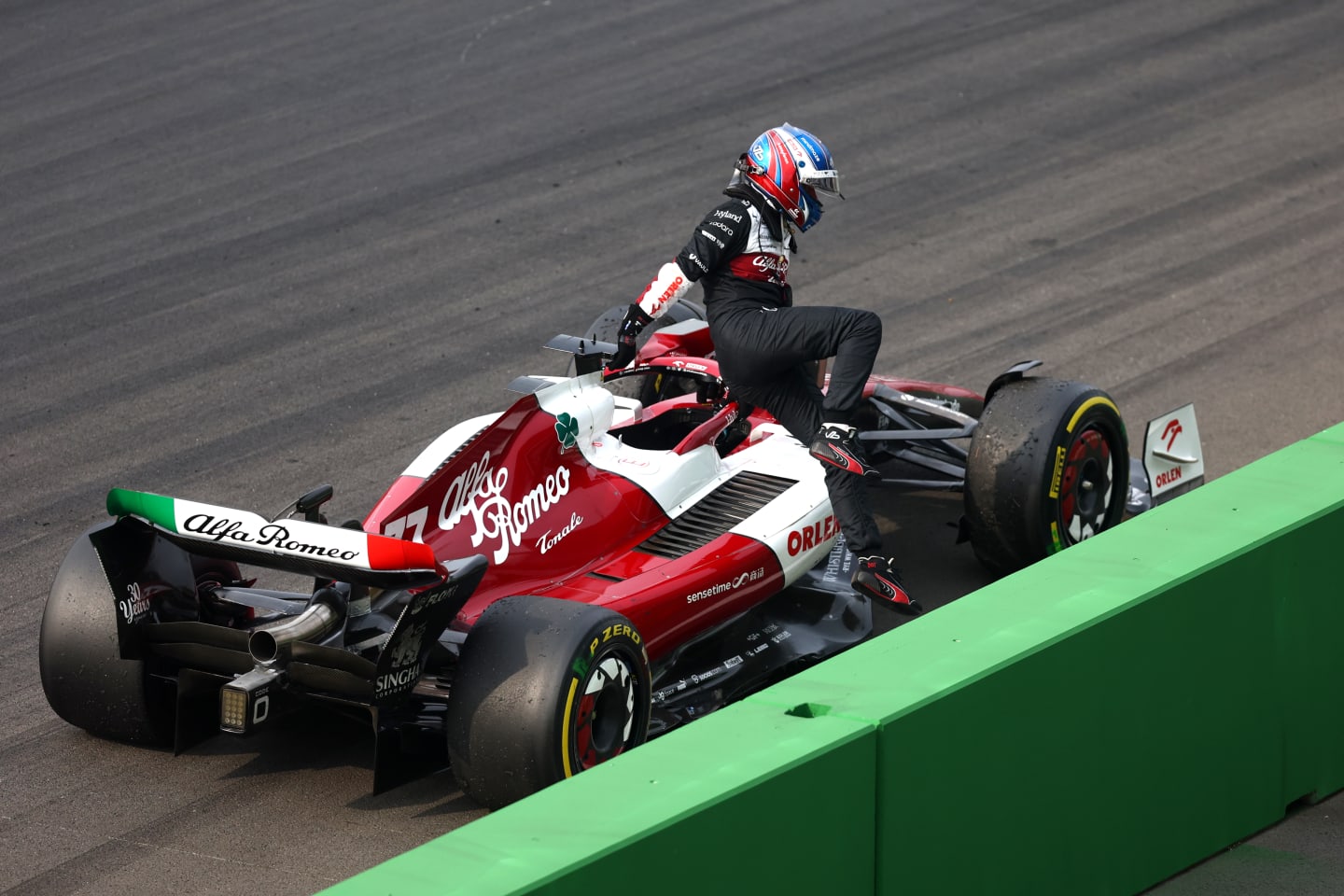 ZANDVOORT, NETHERLANDS - SEPTEMBER 04: Valtteri Bottas of Finland and Alfa Romeo F1 climbs out of their car after stopping on track during the F1 Grand Prix of The Netherlands at Circuit Zandvoort on September 04, 2022 in Zandvoort, Netherlands. (Photo by Lars Baron - Formula 1/Formula 1 via Getty Images)