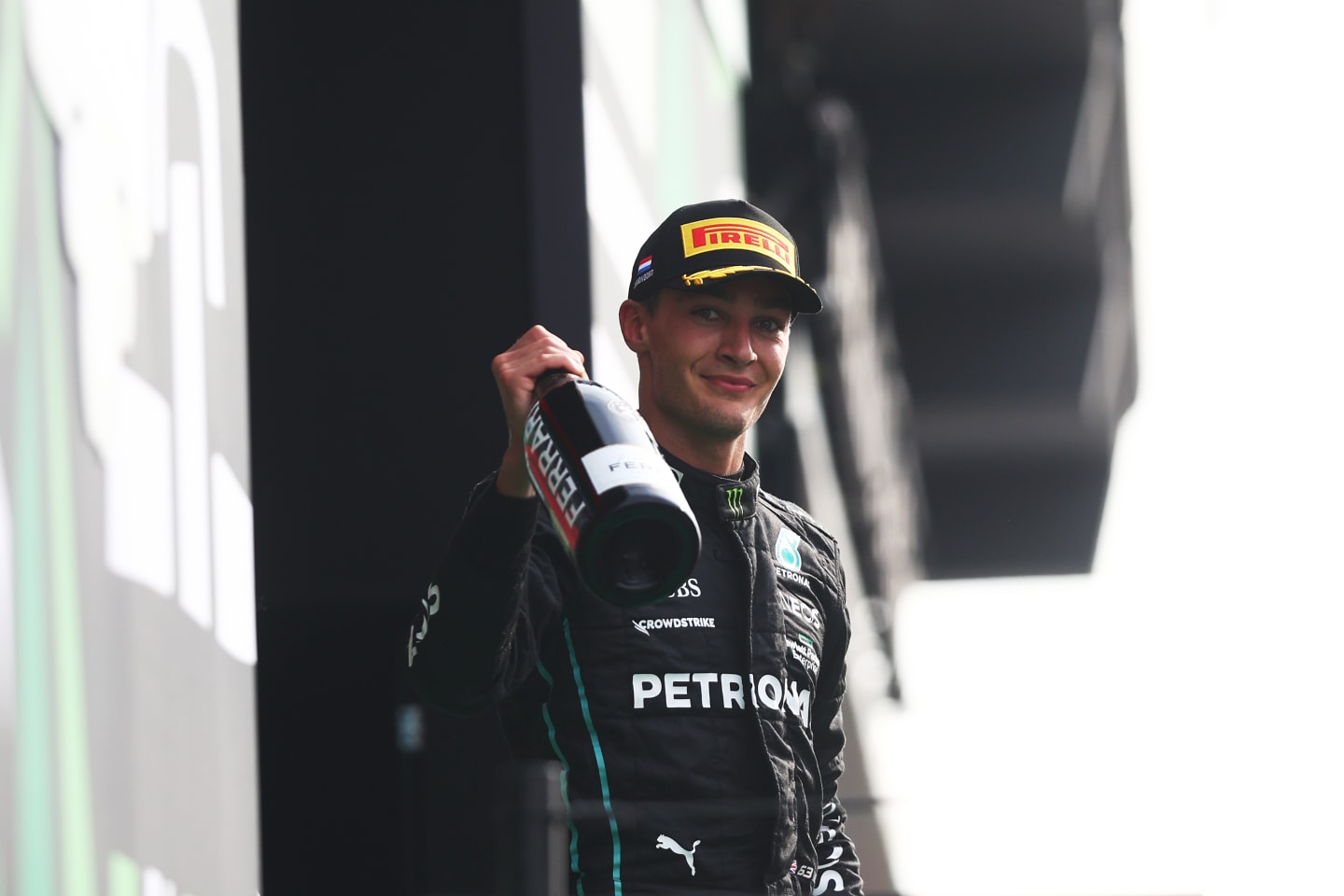 ZANDVOORT, NETHERLANDS - SEPTEMBER 04: Second placed George Russell of Great Britain and Mercedes celebrates on the podium during the F1 Grand Prix of The Netherlands at Circuit Zandvoort on September 04, 2022 in Zandvoort, Netherlands. (Photo by Lars Baron - Formula 1/Formula 1 via Getty Images)