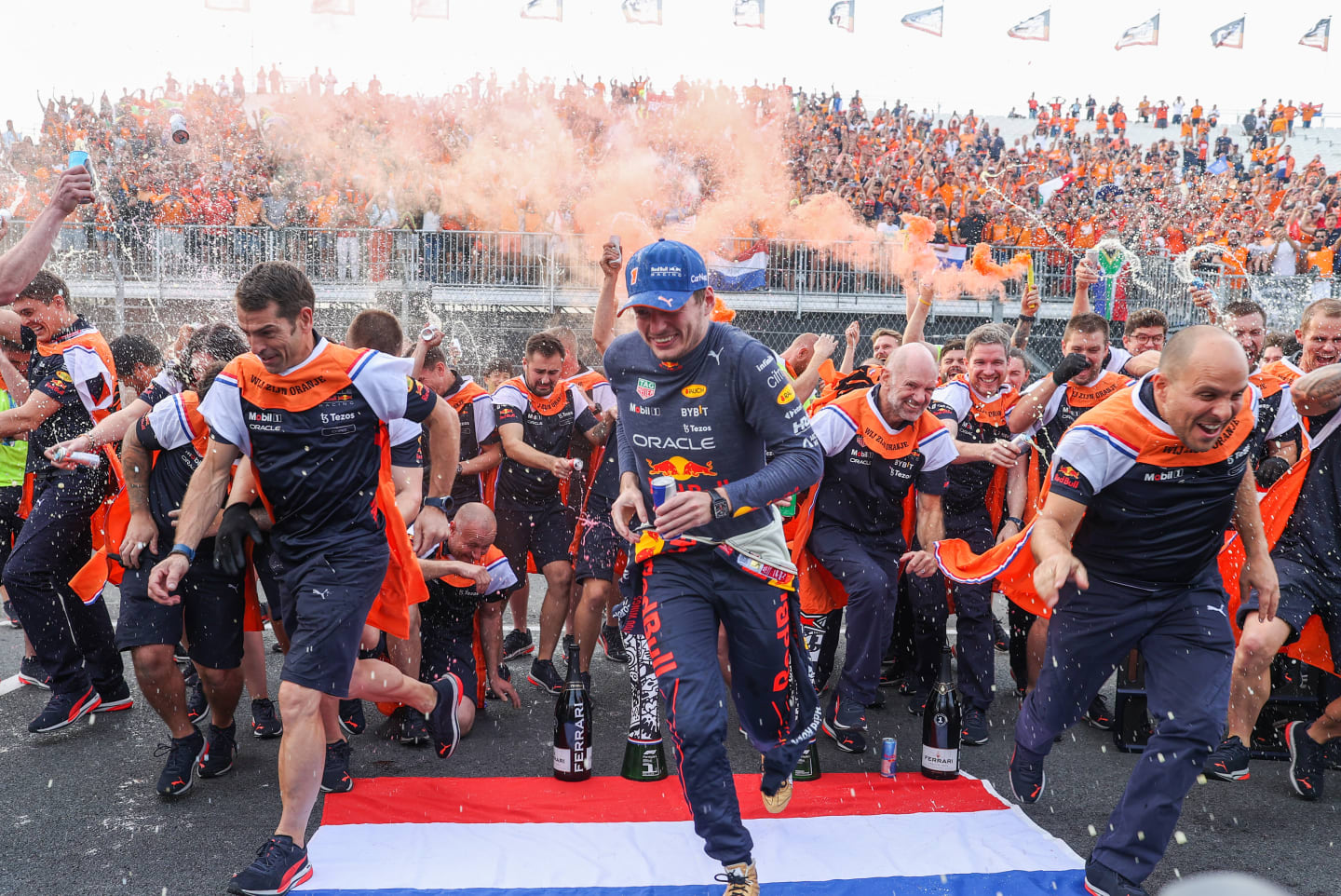 ZANDVOORT, NETHERLANDS - SEPTEMBER 04: Max Verstappen of Red Bull Racing and The Netherlands celebrates with the team after finishing in first position during the F1 Grand Prix of The Netherlands at Circuit Zandvoort on September 04, 2022 in Zandvoort, Netherlands. (Photo by Peter Fox/Getty Images)
