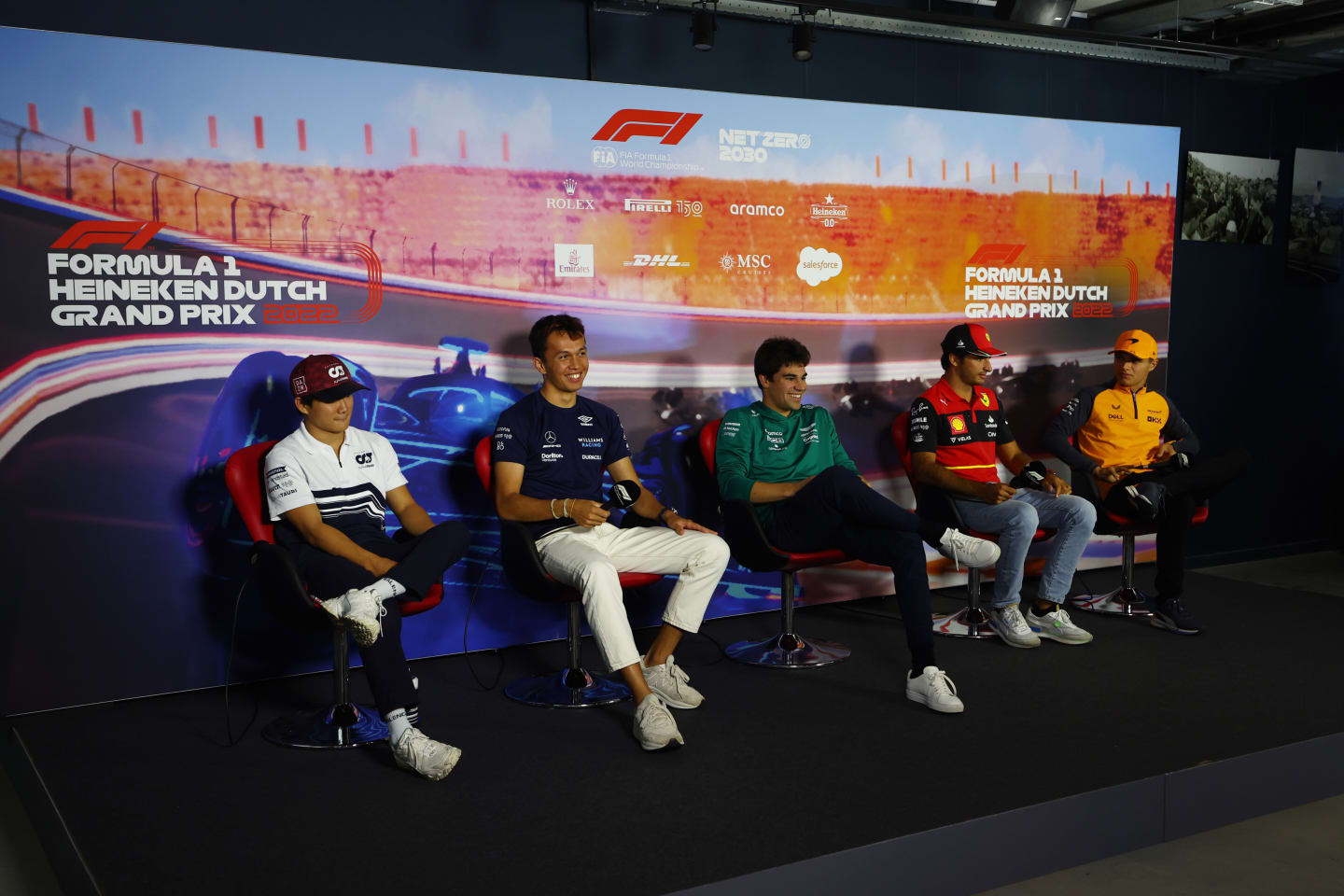 ZANDVOORT, NETHERLANDS - SEPTEMBER 01: (L-R) Yuki Tsunoda of Japan and Scuderia AlphaTauri, Alexander Albon of Thailand and Williams, Lance Stroll of Canada and Aston Martin F1 Team, Carlos Sainz of Spain and Ferrari and Lando Norris of Great Britain and McLaren attend the Drivers Press Conference during previews ahead of the F1 Grand Prix of The Netherlands at Circuit Zandvoort on September 01, 2022 in Zandvoort, Netherlands. (Photo by Lars Baron/Getty Images)