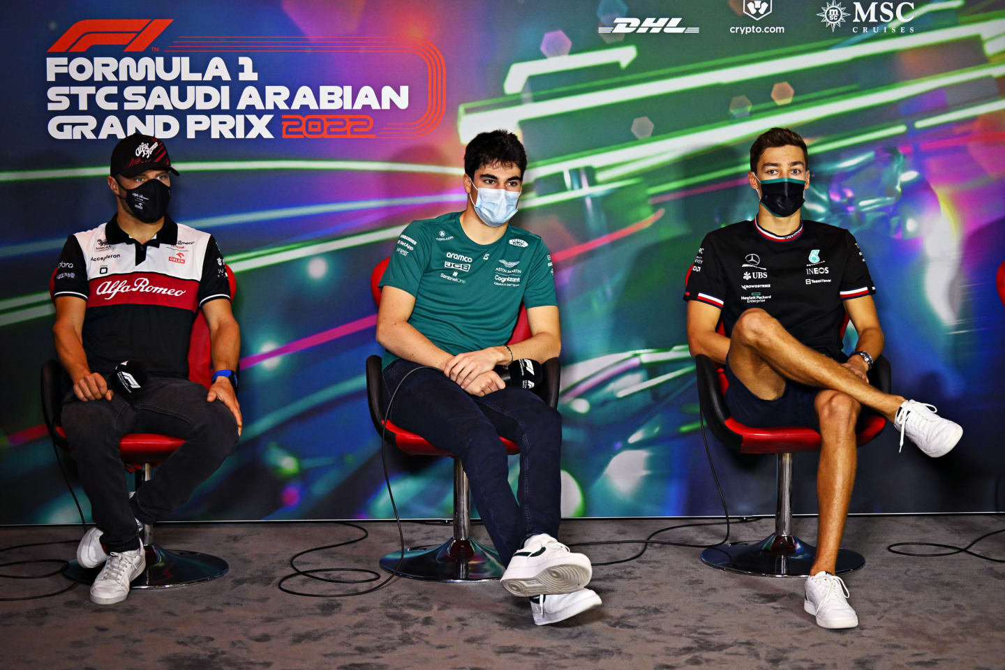 JEDDAH, SAUDI ARABIA - MARCH 25: (L-R) Valtteri Bottas of Finland and Alfa Romeo F1, Lance Stroll of Canada and Aston Martin F1 Team and George Russell of Great Britain and Mercedes attend the Drivers Press Conference before practice ahead of the F1 Grand Prix of Saudi Arabia at the Jeddah Corniche Circuit on March 25, 2022 in Jeddah, Saudi Arabia. (Photo by Clive Mason/Getty Images)