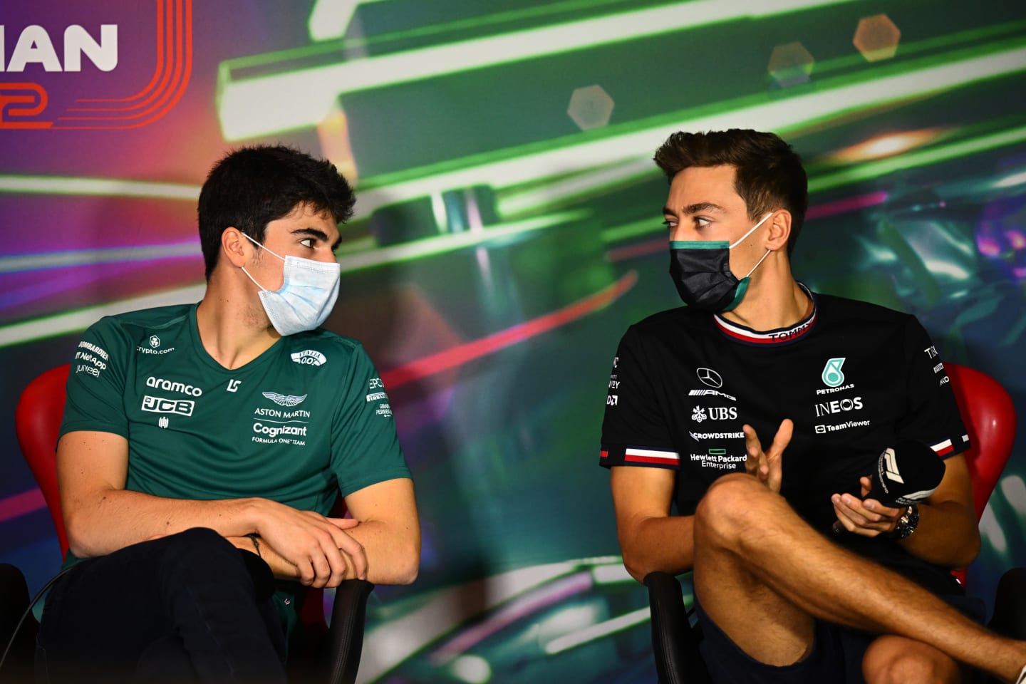 JEDDAH, SAUDI ARABIA - MARCH 25: Lance Stroll of Canada and Aston Martin F1 Team and George Russell of Great Britain and Mercedes talk in the Drivers Press Conference before practice ahead of the F1 Grand Prix of Saudi Arabia at the Jeddah Corniche Circuit on March 25, 2022 in Jeddah, Saudi Arabia. (Photo by Clive Mason/Getty Images)