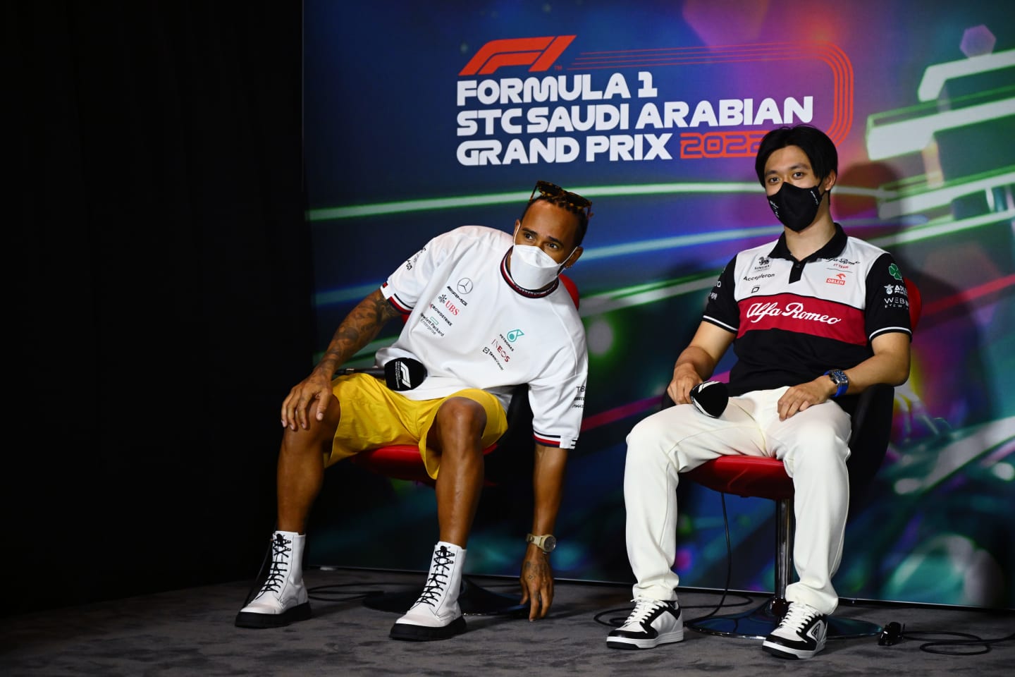 JEDDAH, SAUDI ARABIA - MARCH 25: Lewis Hamilton of Great Britain and Mercedes and Zhou Guanyu of China and Alfa Romeo F1 attend the Drivers Press Conference before practice ahead of the F1 Grand Prix of Saudi Arabia at the Jeddah Corniche Circuit on March 25, 2022 in Jeddah, Saudi Arabia. (Photo by Clive Mason/Getty Images)