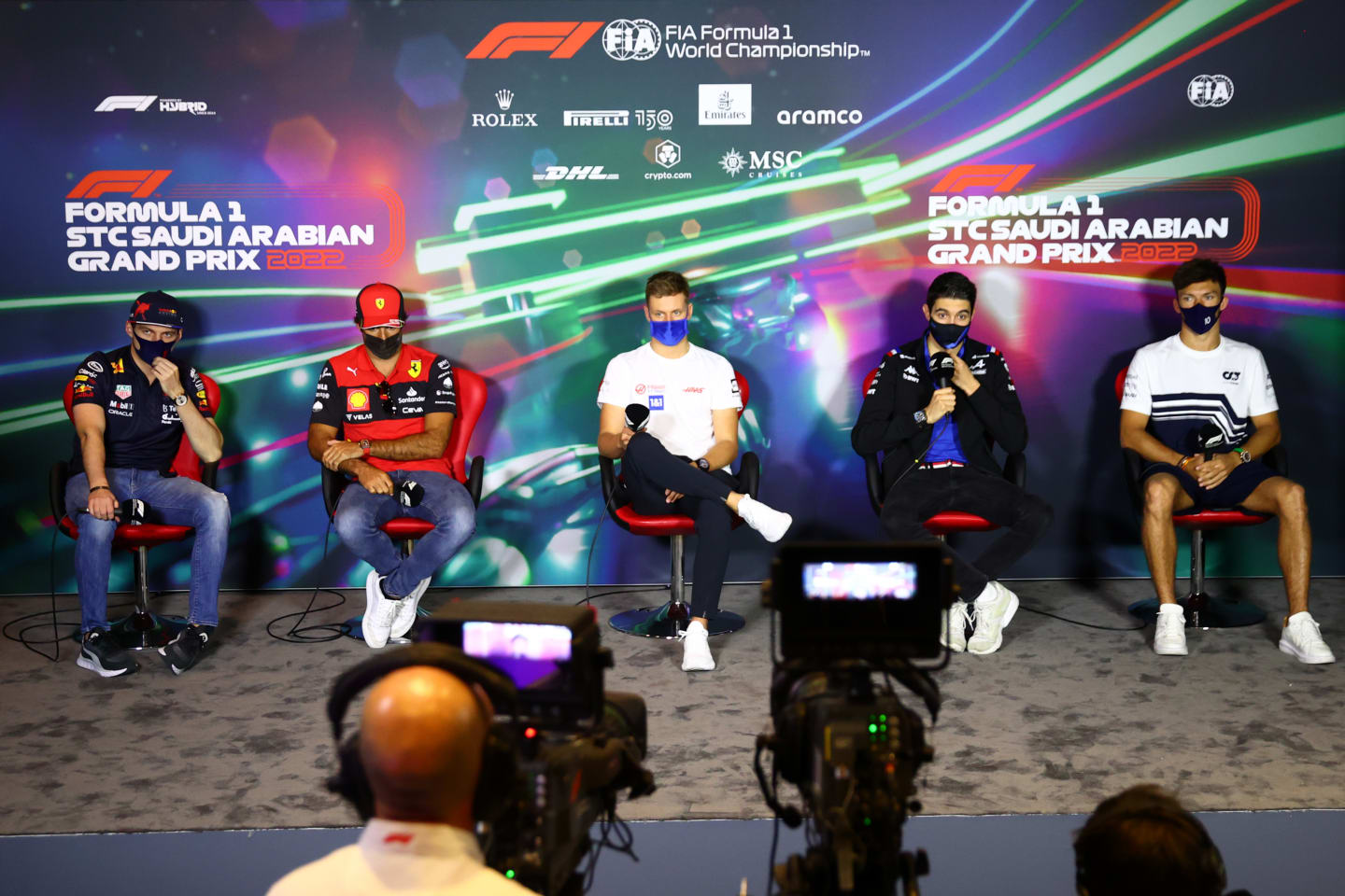JEDDAH, SAUDI ARABIA - MARCH 25: (L-R) Max Verstappen of the Netherlands and Oracle Red Bull Racing, Carlos Sainz of Spain and Ferrari, Mick Schumacher of Germany and Haas F1, Esteban Ocon of France and Alpine F1 and Pierre Gasly of France and Scuderia AlphaTauri attend the Drivers Press Conference before practice ahead of the F1 Grand Prix of Saudi Arabia at the Jeddah Corniche Circuit on March 25, 2022 in Jeddah, Saudi Arabia. (Photo by Dan Istitene - Formula 1/Formula 1 via Getty Images)