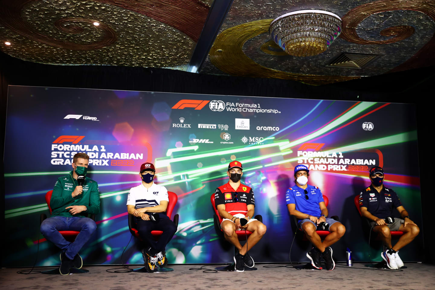 JEDDAH, SAUDI ARABIA - MARCH 25: (L-R) Nico Hulkenberg of Germany and Aston Martin F1 Team, Yuki Tsunoda of Japan and Scuderia AlphaTauri, Charles Leclerc of Monaco and Ferrari, Fernando Alonso of Spain and Alpine F1 and Sergio Perez of Mexico and Oracle Red Bull Racing attend the Drivers Press Conference before practice ahead of the F1 Grand Prix of Saudi Arabia at the Jeddah Corniche Circuit on March 25, 2022 in Jeddah, Saudi Arabia. (Photo by Dan Istitene - Formula 1/Formula 1 via Getty Images)