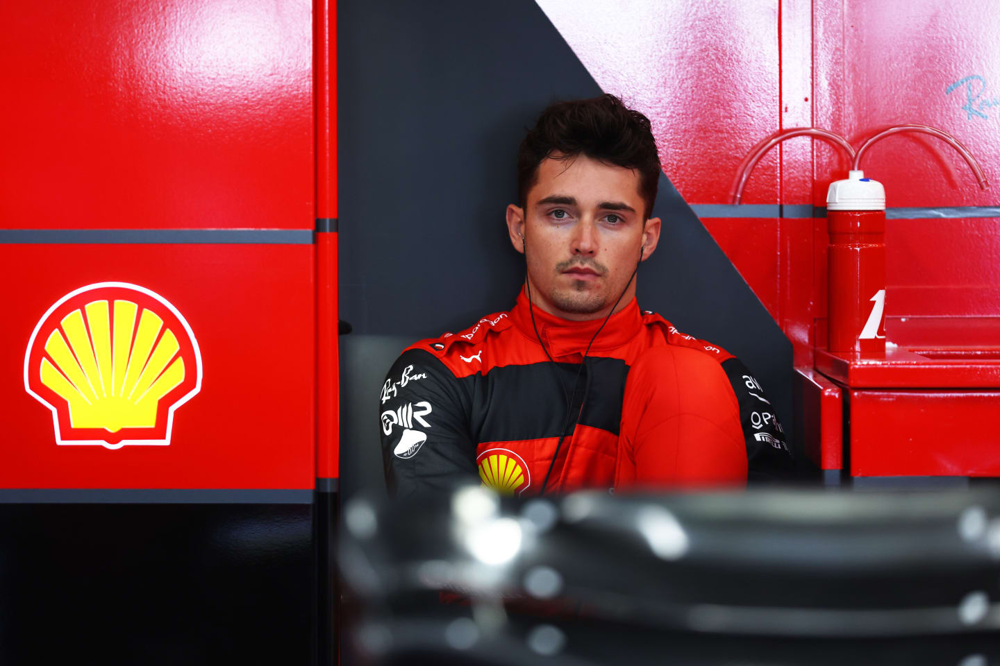 JEDDAH, SAUDI ARABIA - MARCH 25: Charles Leclerc of Monaco and Ferrari prepares to drive in the garage during practice ahead of the F1 Grand Prix of Saudi Arabia at the Jeddah Corniche Circuit on March 25, 2022 in Jeddah, Saudi Arabia. (Photo by Lars Baron/Getty Images)