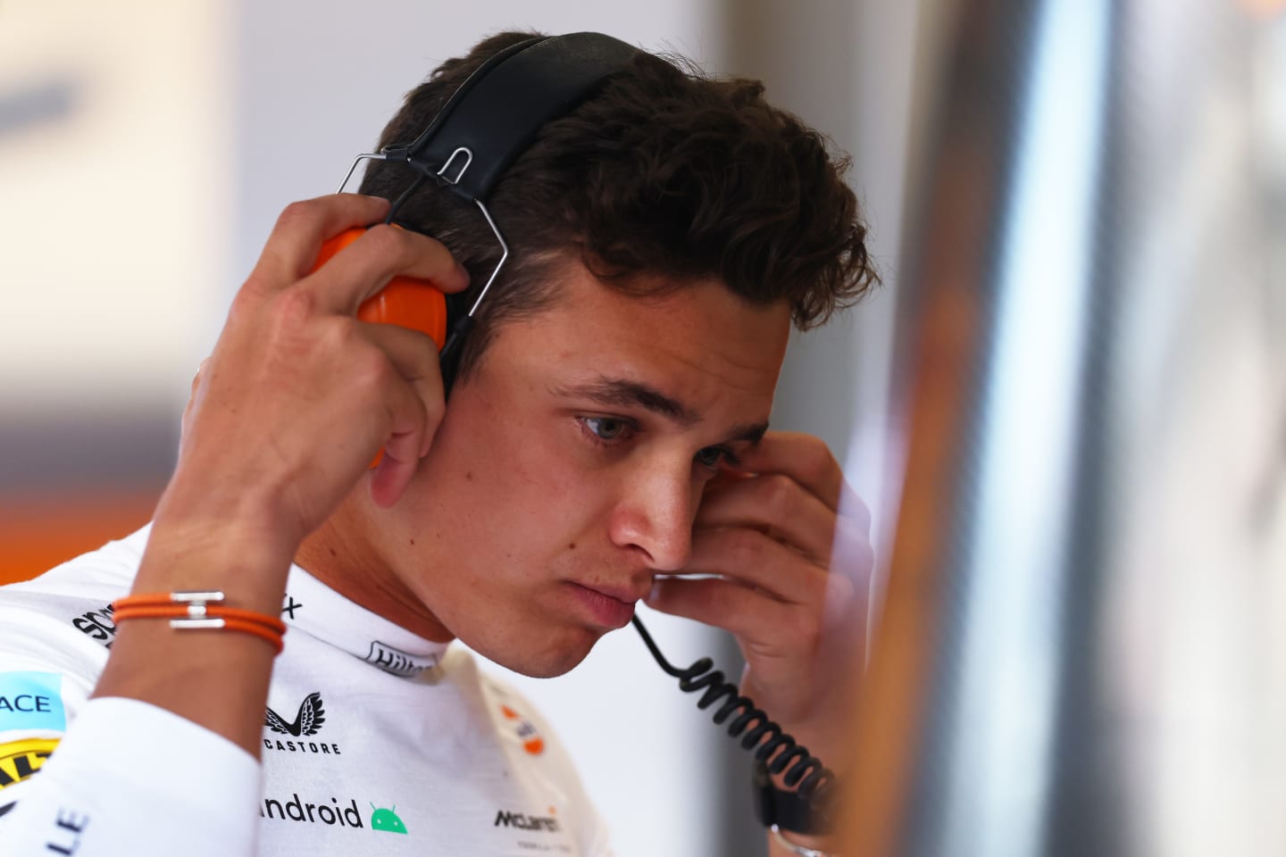 JEDDAH, SAUDI ARABIA - MARCH 25: Lando Norris of Great Britain and McLaren looks on in the garage during practice ahead of the F1 Grand Prix of Saudi Arabia at the Jeddah Corniche Circuit on March 25, 2022 in Jeddah, Saudi Arabia. (Photo by Lars Baron/Getty Images)