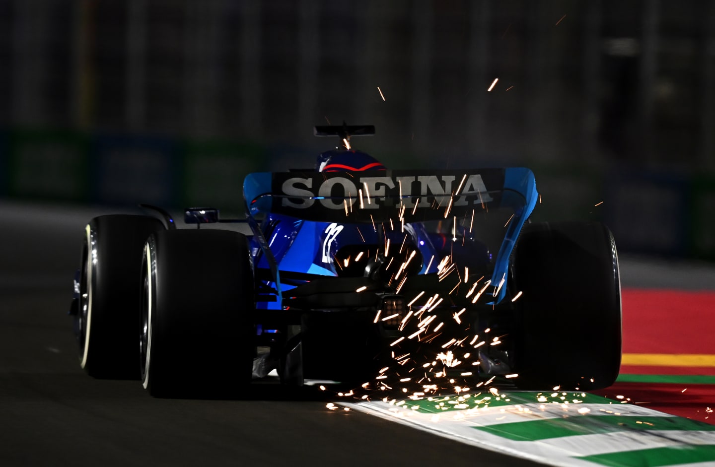 JEDDAH, SAUDI ARABIA - MARCH 25: Sparks fly behind Alexander Albon of Thailand driving the (23) Williams FW44 Mercedes on track during practice ahead of the F1 Grand Prix of Saudi Arabia at the Jeddah Corniche Circuit on March 25, 2022 in Jeddah, Saudi Arabia. (Photo by Clive Mason/Getty Images)