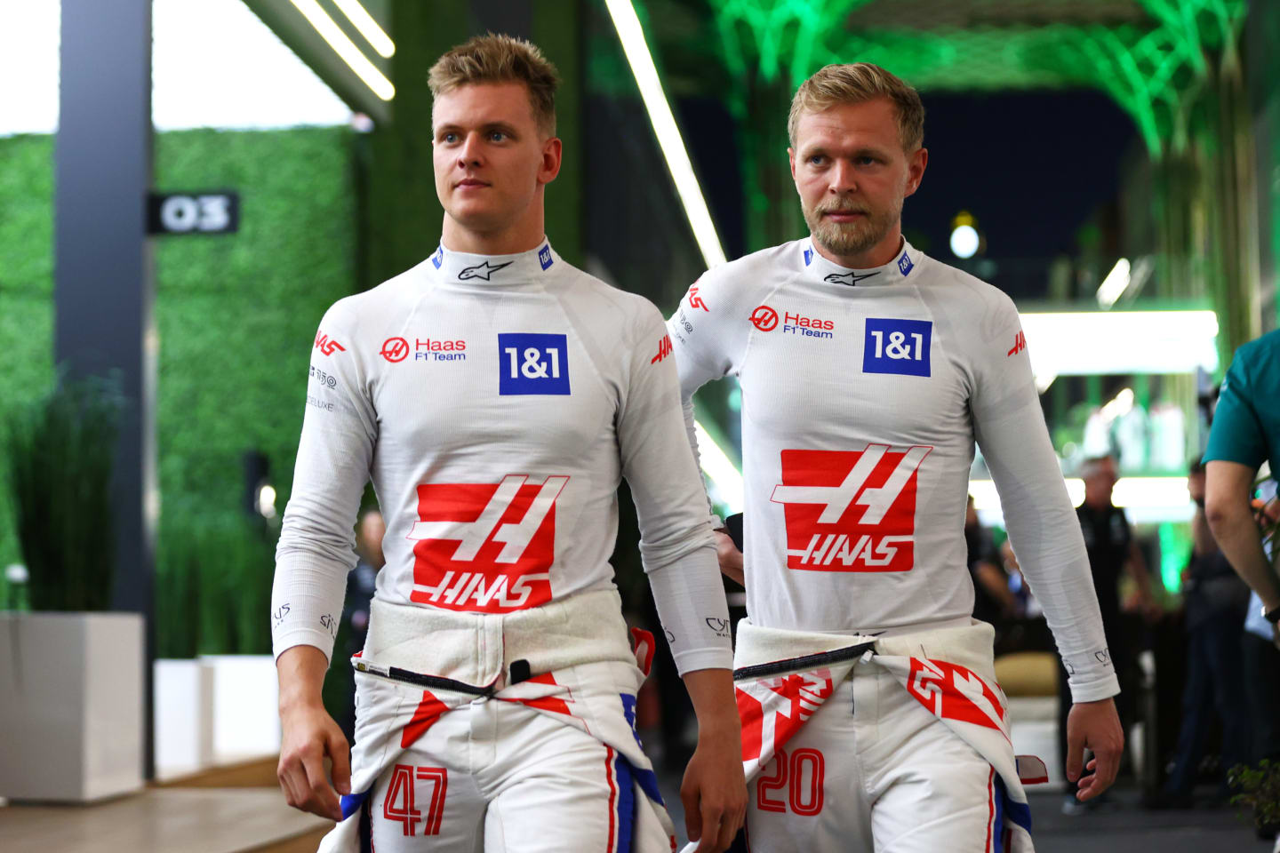 JEDDAH, SAUDI ARABIA - MARCH 25:  Mick Schumacher of Germany and Haas F1 and Kevin Magnussen of Denmark and Haas F1 walk in the paddock after practice ahead of the F1 Grand Prix of Saudi Arabia at the Jeddah Corniche Circuit on March 25, 2022 in Jeddah, Saudi Arabia. (Photo by Dan Istitene - Formula 1/Formula 1 via Getty Images)