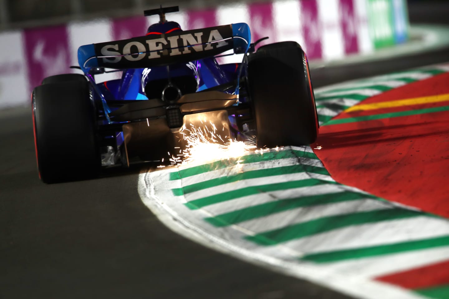 JEDDAH, SAUDI ARABIA - MARCH 26: Sparks fly behind Alexander Albon of Thailand driving the (23) Williams FW44 Mercedes on track during qualifying ahead of the F1 Grand Prix of Saudi Arabia at the Jeddah Corniche Circuit on March 26, 2022 in Jeddah, Saudi Arabia. (Photo by Joe Portlock - Formula 1/Formula 1 via Getty Images)