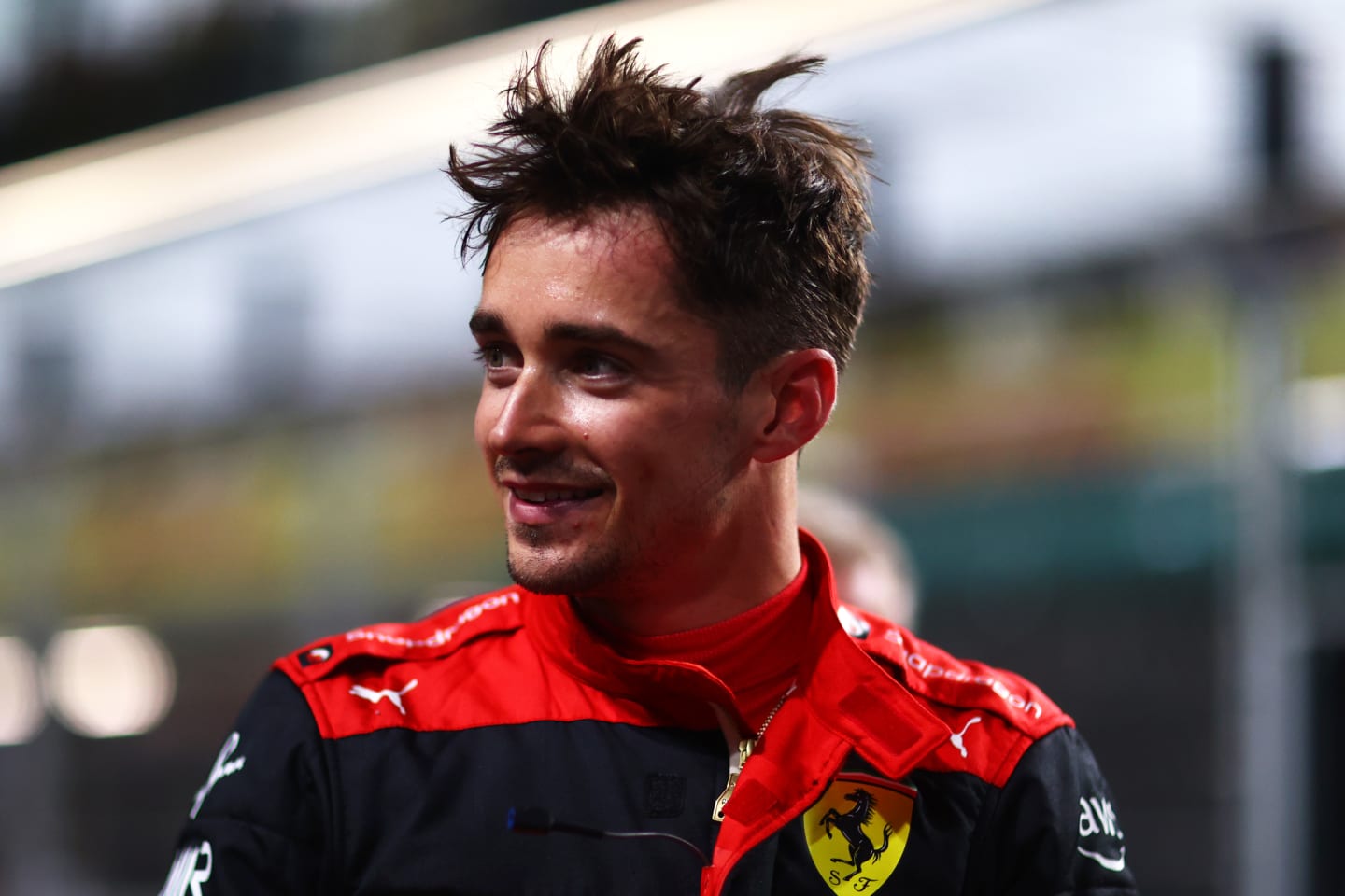 JEDDAH, SAUDI ARABIA - MARCH 26: Second placed qualifier Charles Leclerc of Monaco and Ferrari smiles in parc ferme during qualifying ahead of the F1 Grand Prix of Saudi Arabia at the Jeddah Corniche Circuit on March 26, 2022 in Jeddah, Saudi Arabia. (Photo by Dan Istitene - Formula 1/Formula 1 via Getty Images)