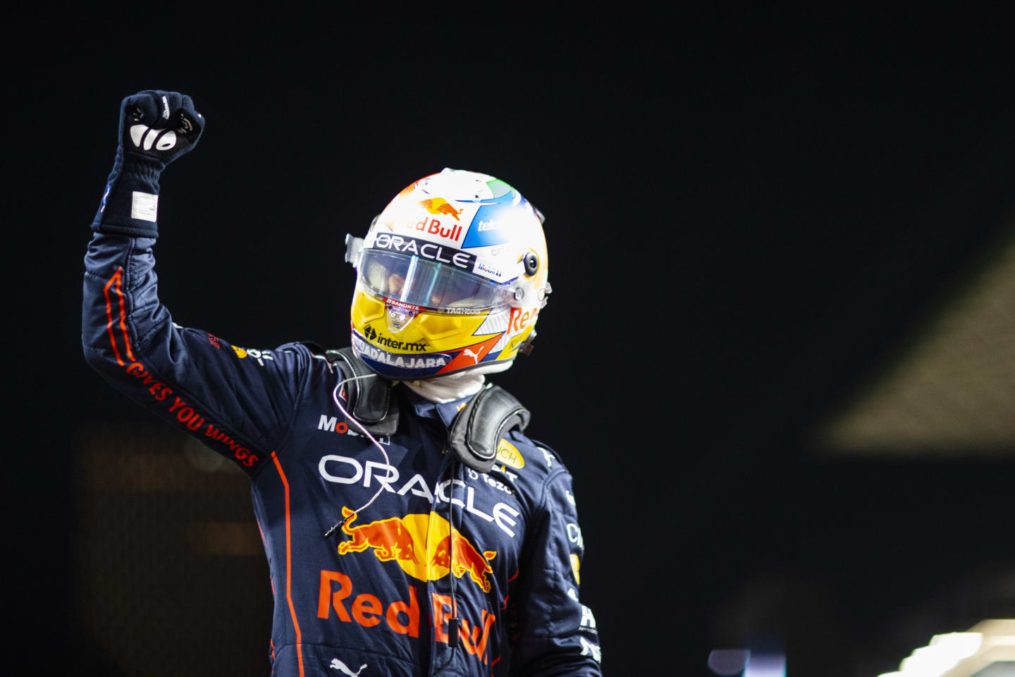 JEDDAH, SAUDI ARABIA - MARCH 26: Pole position qualifier Sergio Perez of Mexico and Oracle Red Bull Racing celebrates in parc ferme during qualifying ahead of the F1 Grand Prix of Saudi Arabia at the Jeddah Corniche Circuit on March 26, 2022 in Jeddah, Saudi Arabia. (Photo by Dan Istitene - Formula 1/Formula 1 via Getty Images)