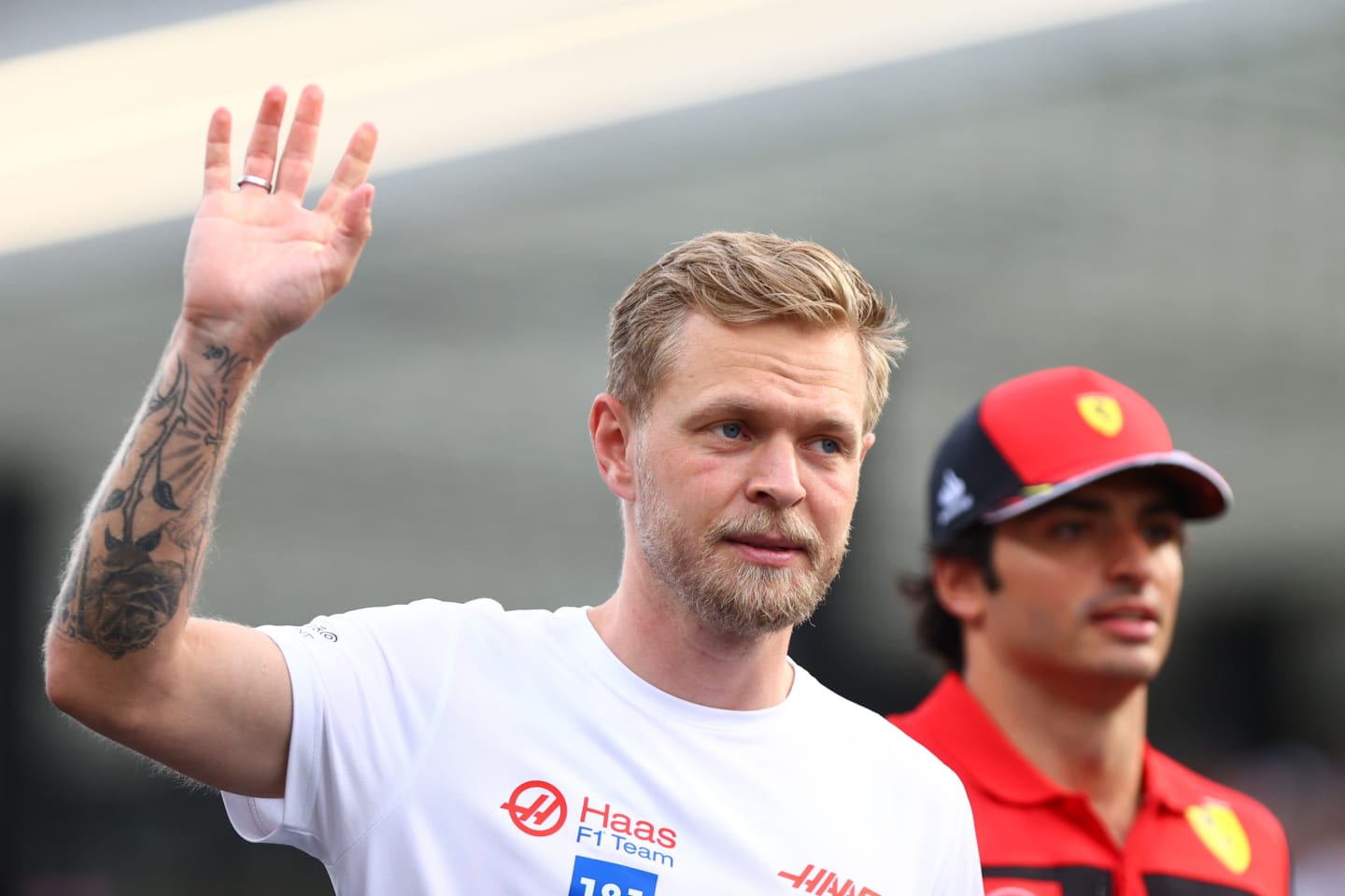 JEDDAH, SAUDI ARABIA - MARCH 27: Kevin Magnussen of Denmark and Haas F1 waves to the crowd from the drivers parade ahead of the F1 Grand Prix of Saudi Arabia at the Jeddah Corniche Circuit on March 27, 2022 in Jeddah, Saudi Arabia. (Photo by Dan Istitene - Formula 1/Formula 1 via Getty Images)