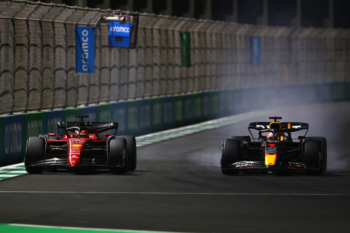 JEDDAH, SAUDI ARABIA - MARCH 27: Max Verstappen of the Netherlands driving the (1) Oracle Red Bull Racing RB18 and Charles Leclerc of Monaco driving (16) the Ferrari F1-75 battle for track position during the F1 Grand Prix of Saudi Arabia at the Jeddah Corniche Circuit on March 27, 2022 in Jeddah, Saudi Arabia. (Photo by Joe Portlock - Formula 1/Formula 1 via Getty Images)